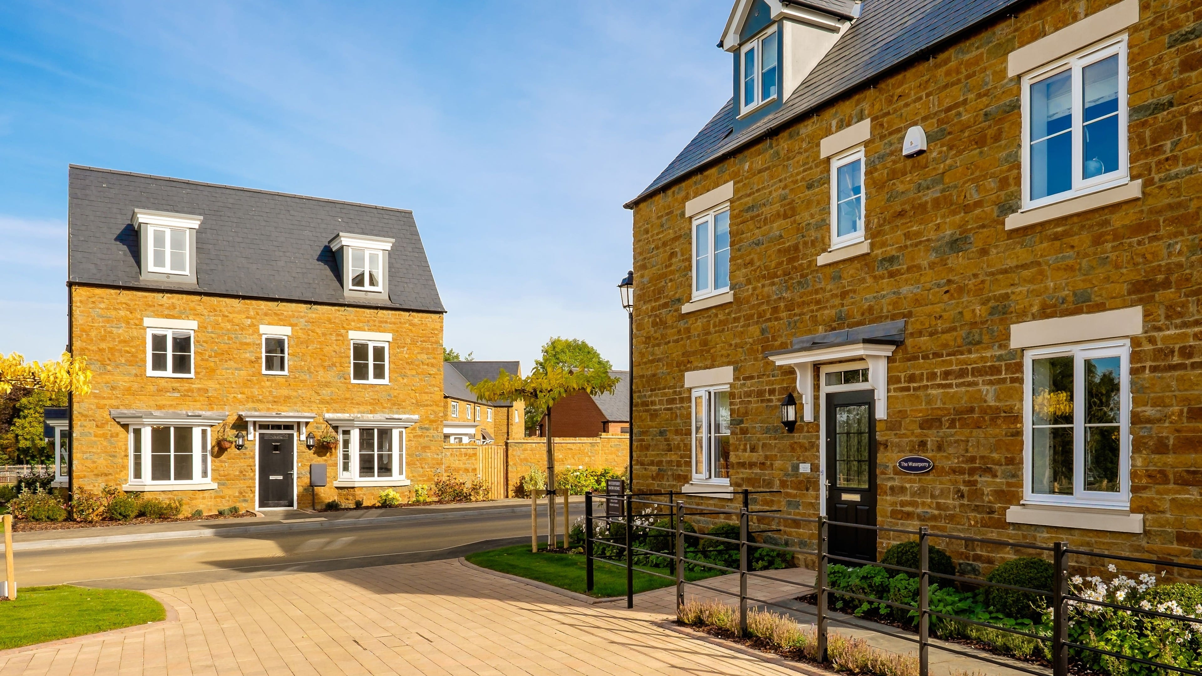 Britain’s biggest housebuilder slows land buying and cuts home sales outlook