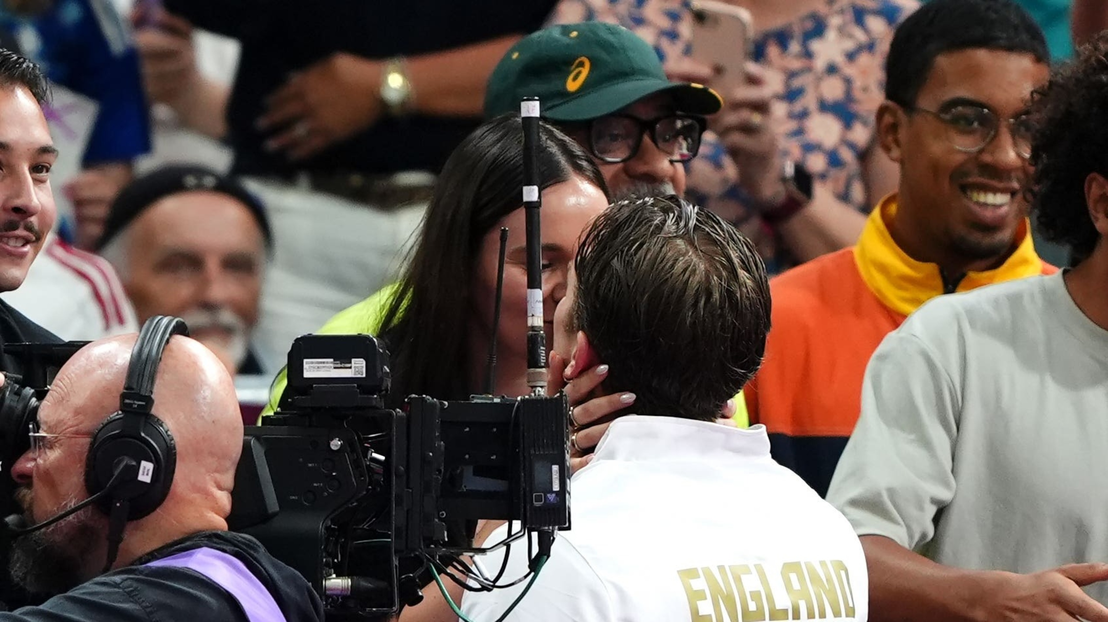 Swimmer Adam Ramsay-Peaty kisses pregnant wife Holly after winning bronze