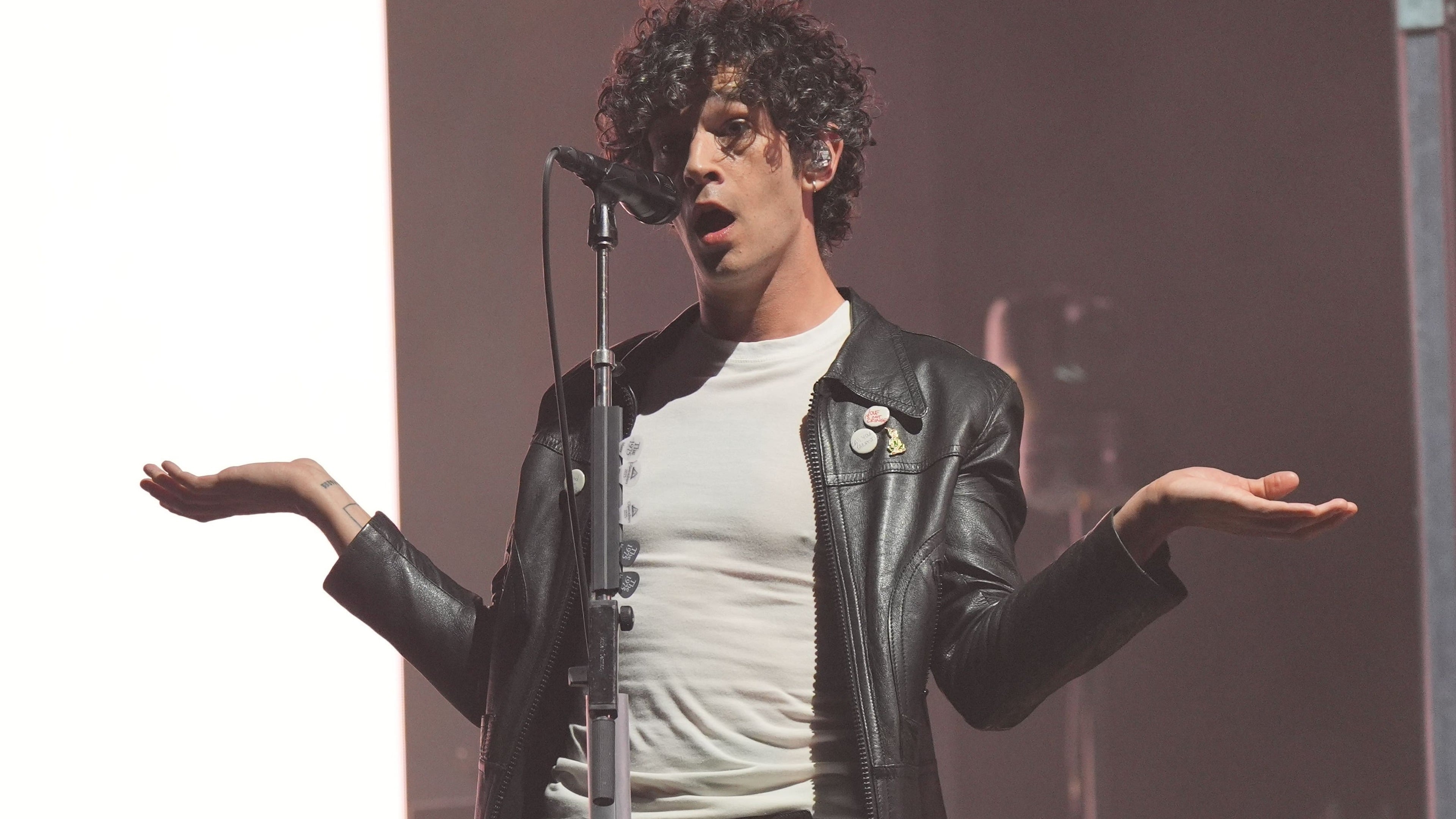 Matty Healy performs with a The 1975 tribute band at his bachelor party