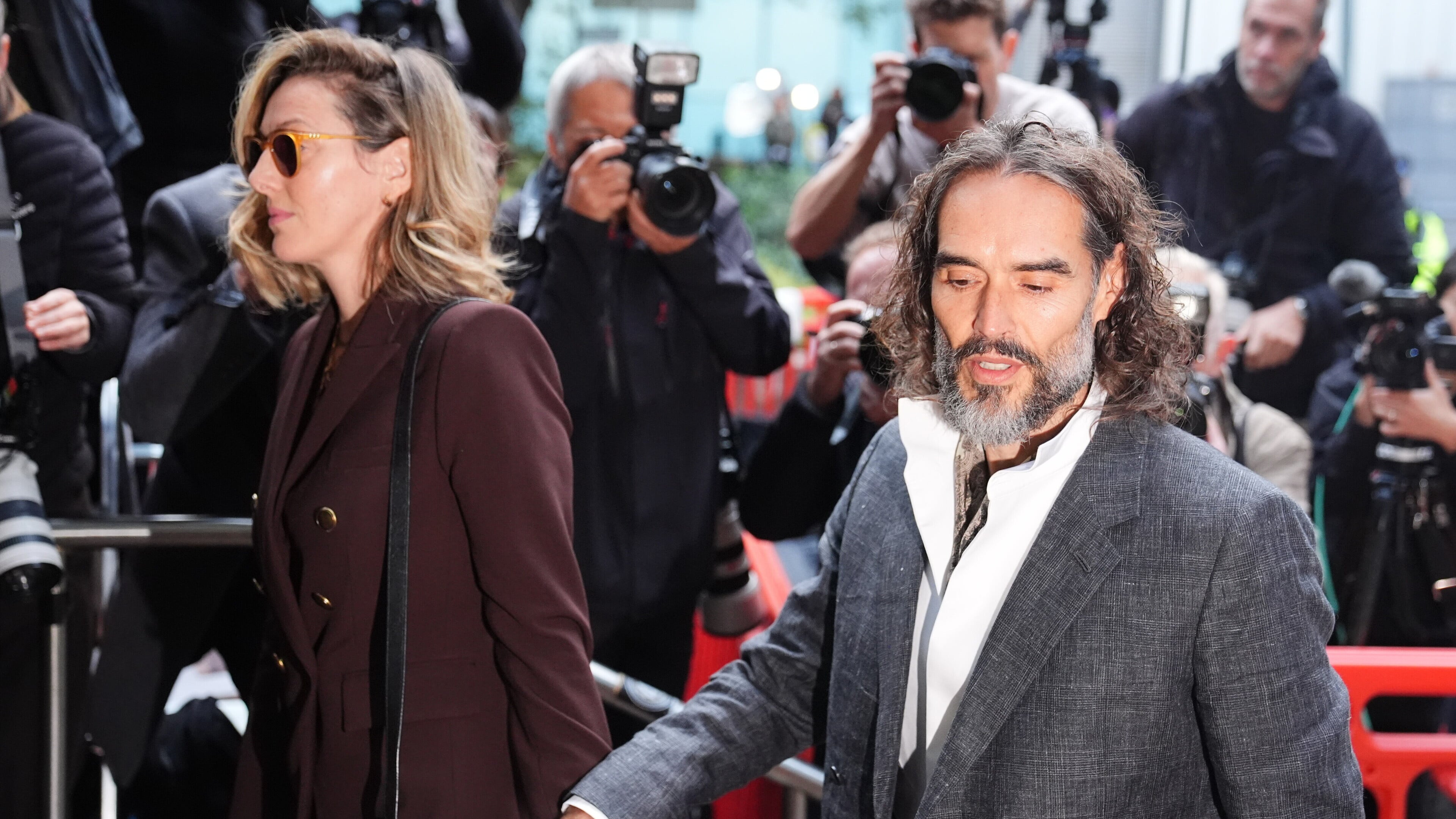 Russell Brand arrives with wife Laura Gallacher for rape trial at Southwark Crown Court
