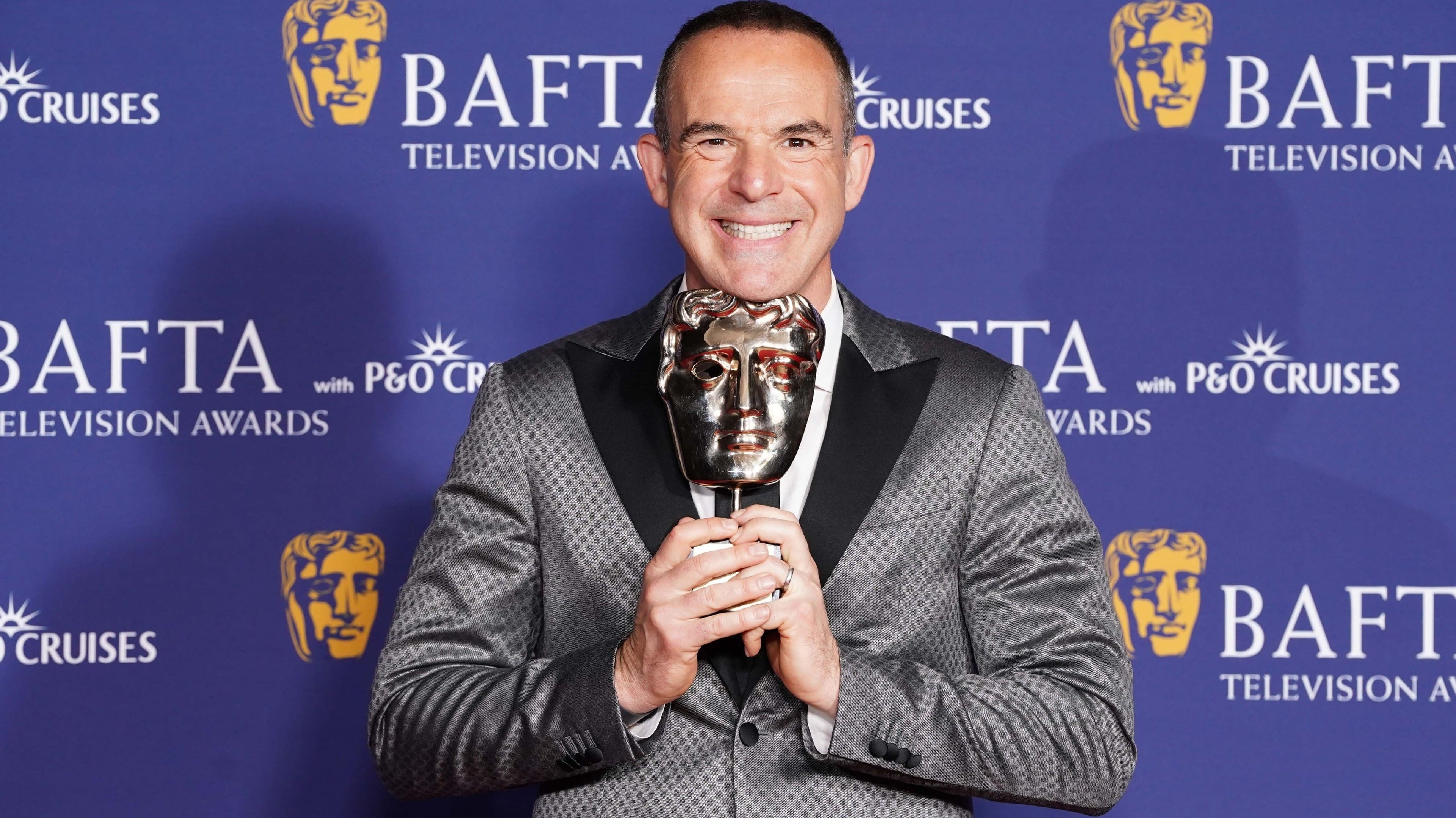 Martin Lewis reflects on childhood while receiving Bafta special award
