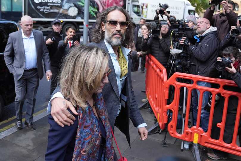 Russell Brand with his wife Laura Gallacher arriving at Southwark Crown Court (Maja Smiejkowska/PA)