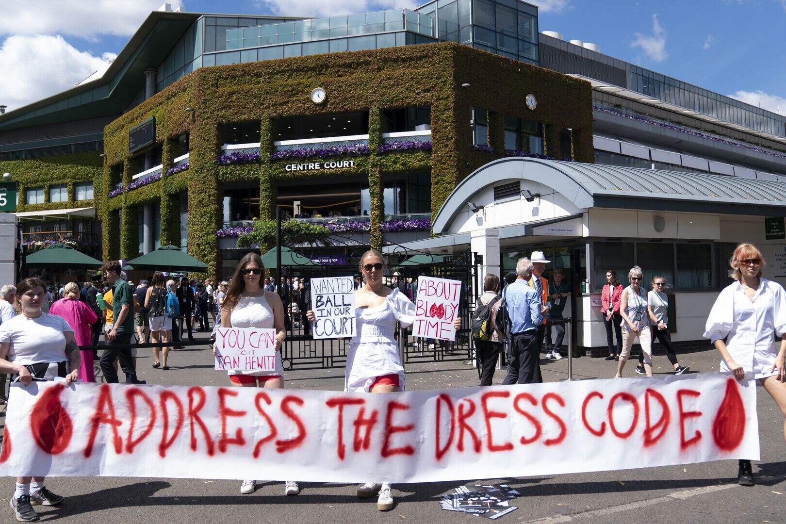 Group in red shorts protest against Wimbledon dress code over period ...