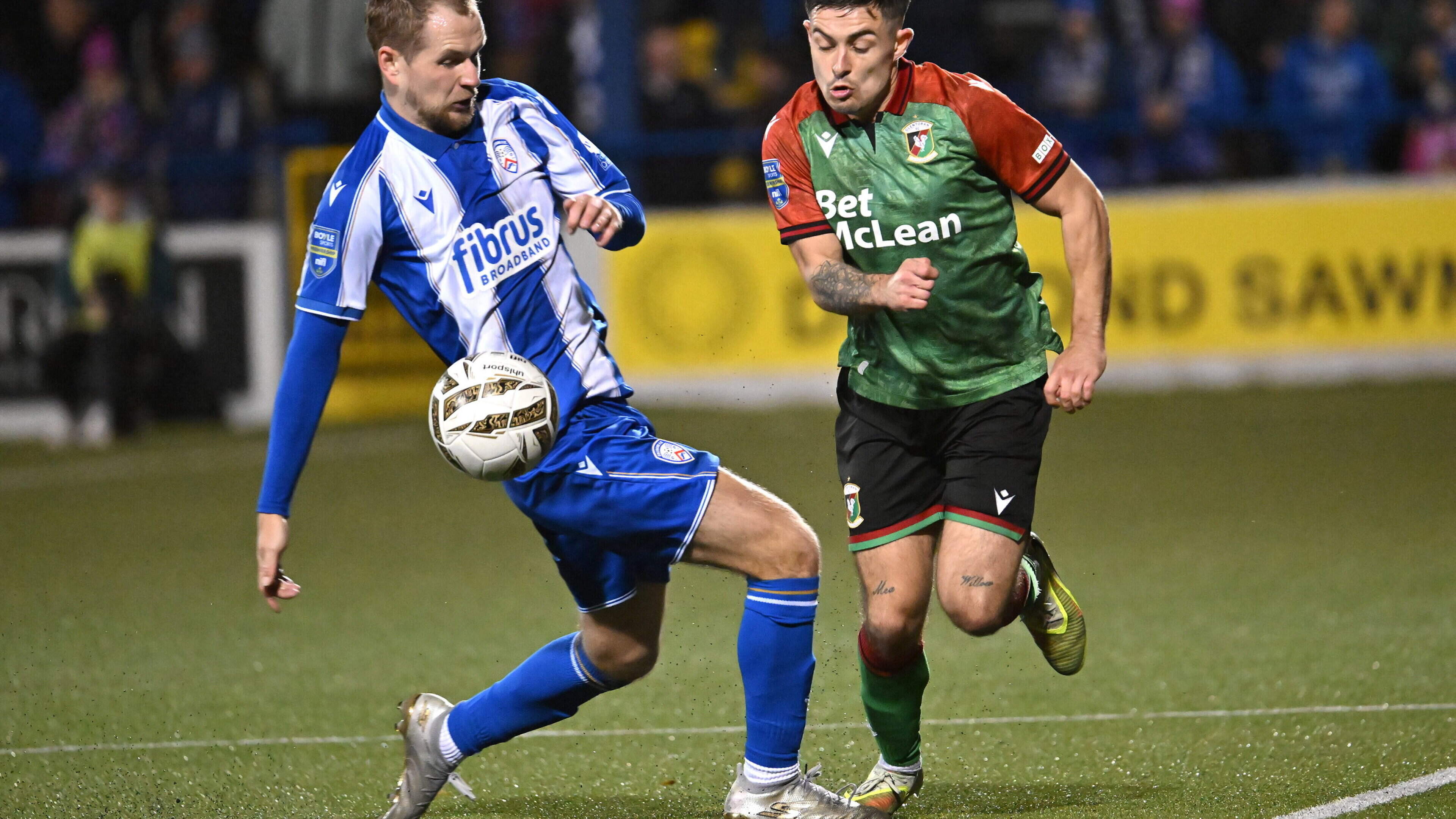 Coleraine’s Rowan McDonald tries to challenge Glentoran’s Jordan Stewart © INPHO/Stephen Hamilton