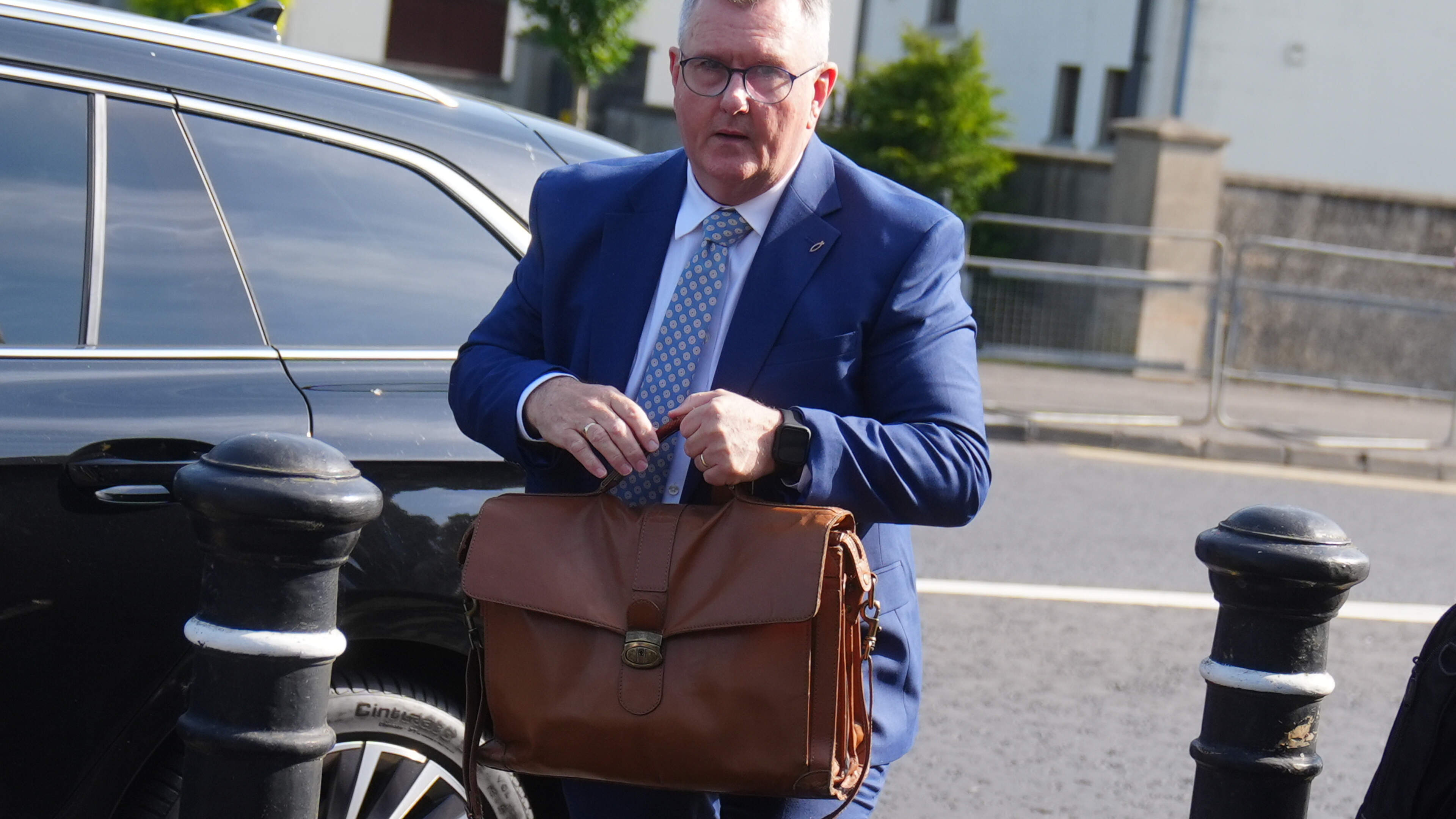 Jeffrey Donaldson arrives at court for sexual offences trial as prosecution prepares to deliver opening address