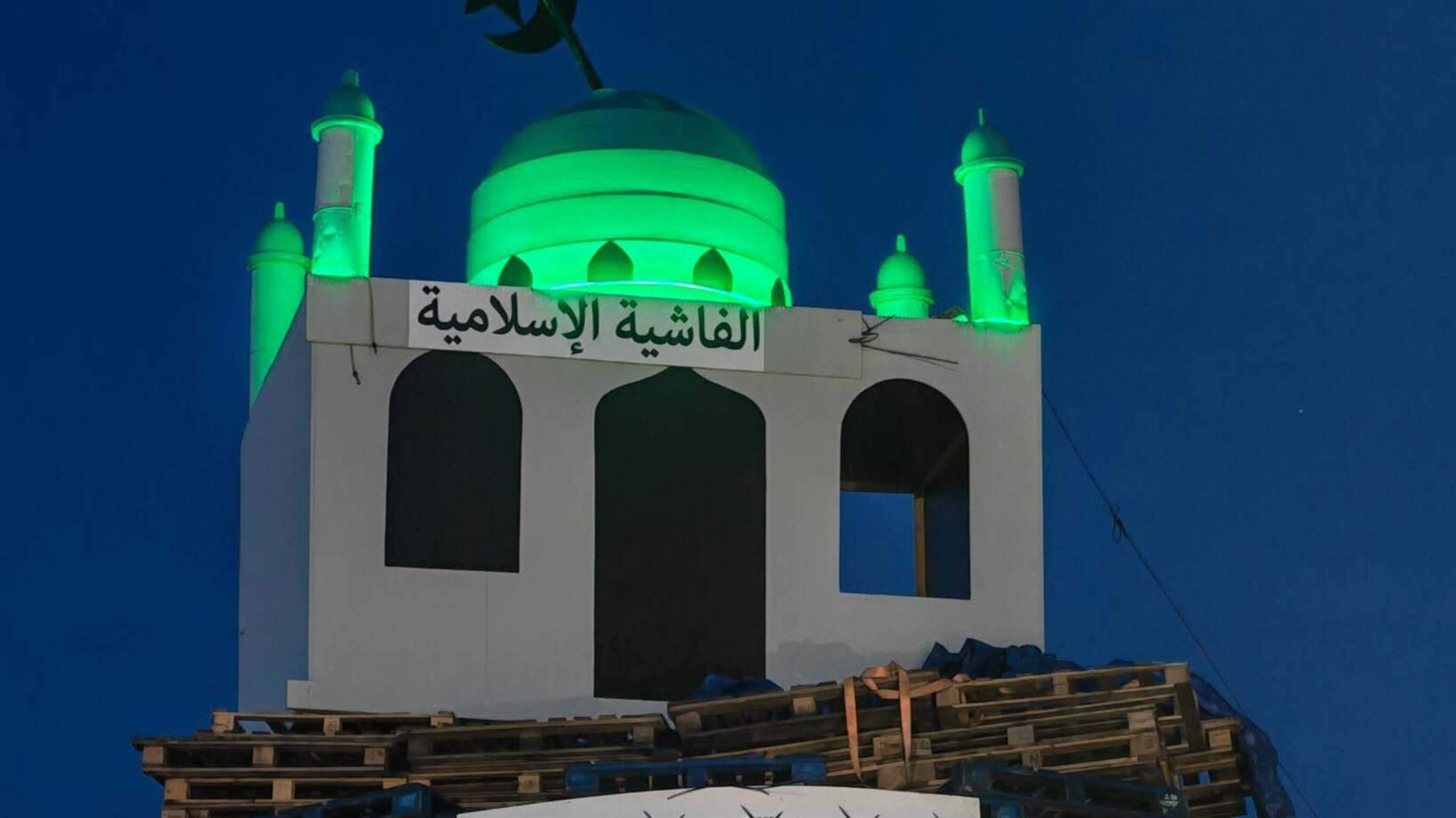 Man arrested after replica of mosque placed on top of loyalist bonfire