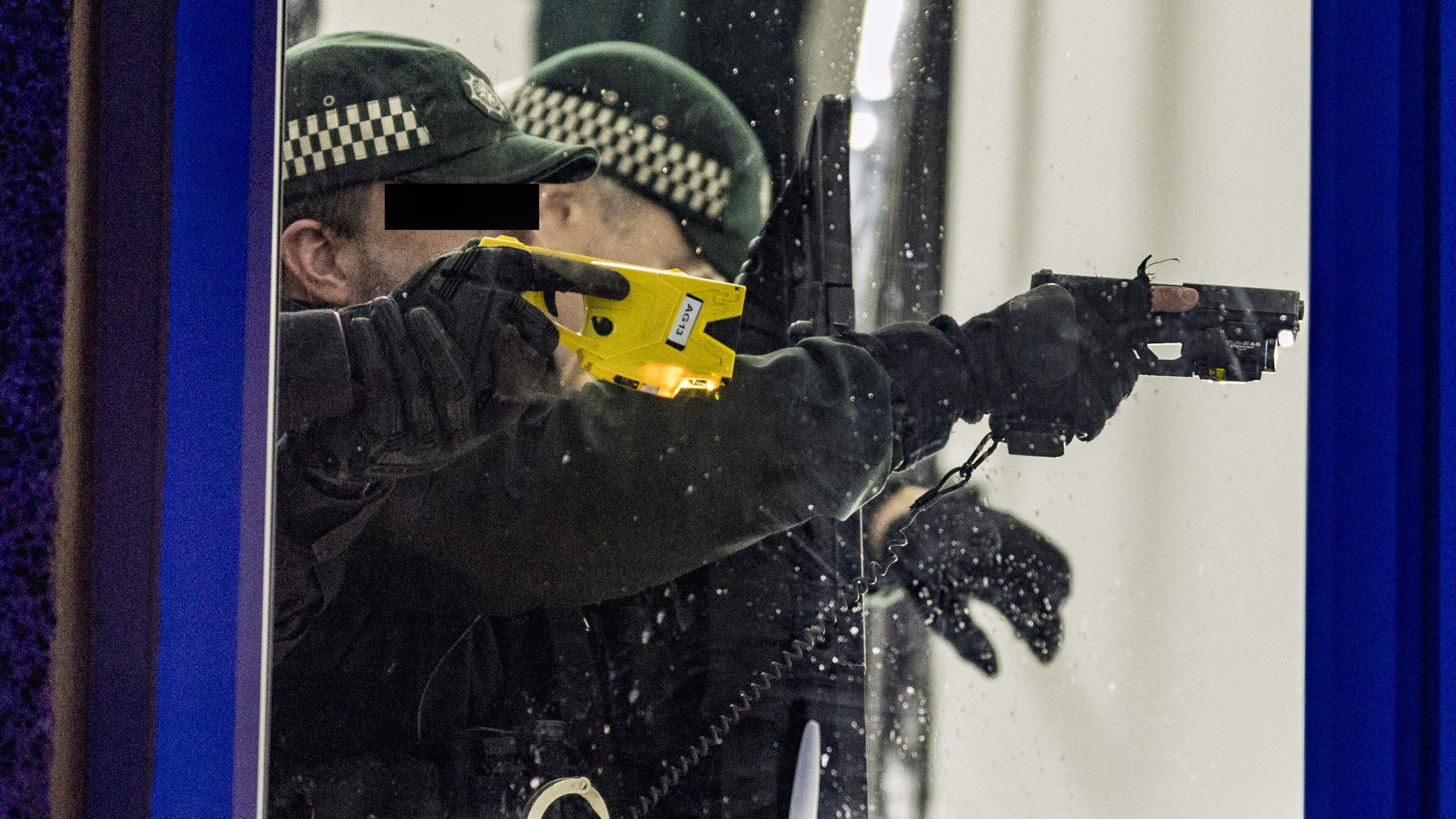 Masked sword-wielding man fires crossbow at heavily armed cops during four-hour stand-off