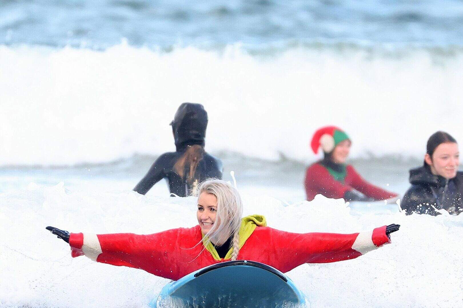 Surfers have a swell time in Portrush for Wave Project charity ...