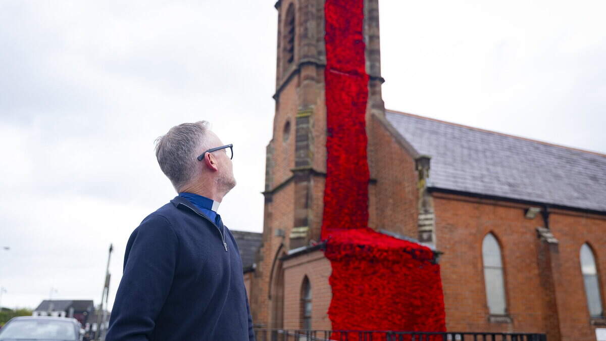 Community knits together to transform Co Antrim church tower with 13,000 poppies