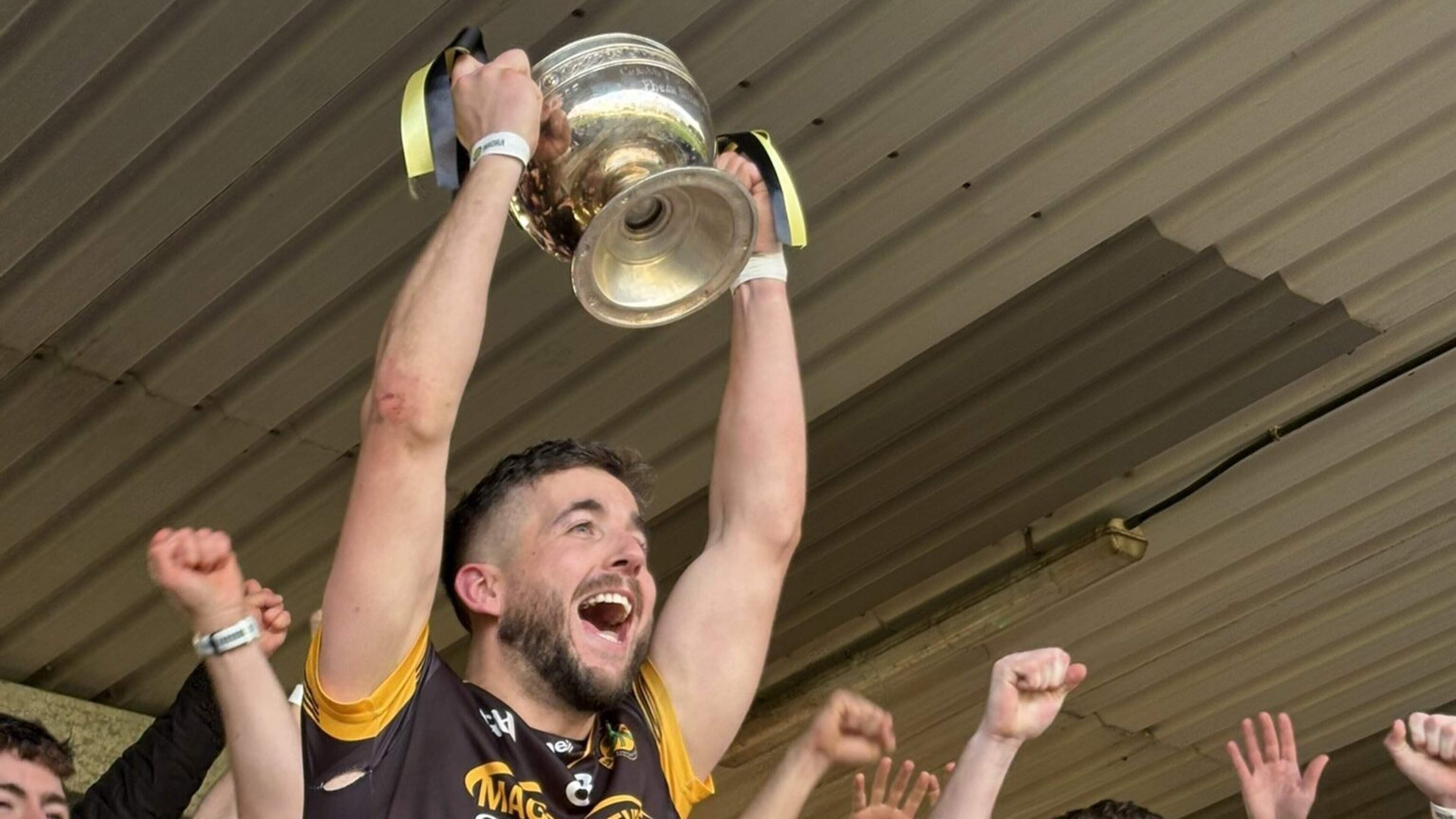 Erne Gaels captain Ryan Lyons lifts the Fermanagh Senior Football Championship trophy © Fermanagh GAA