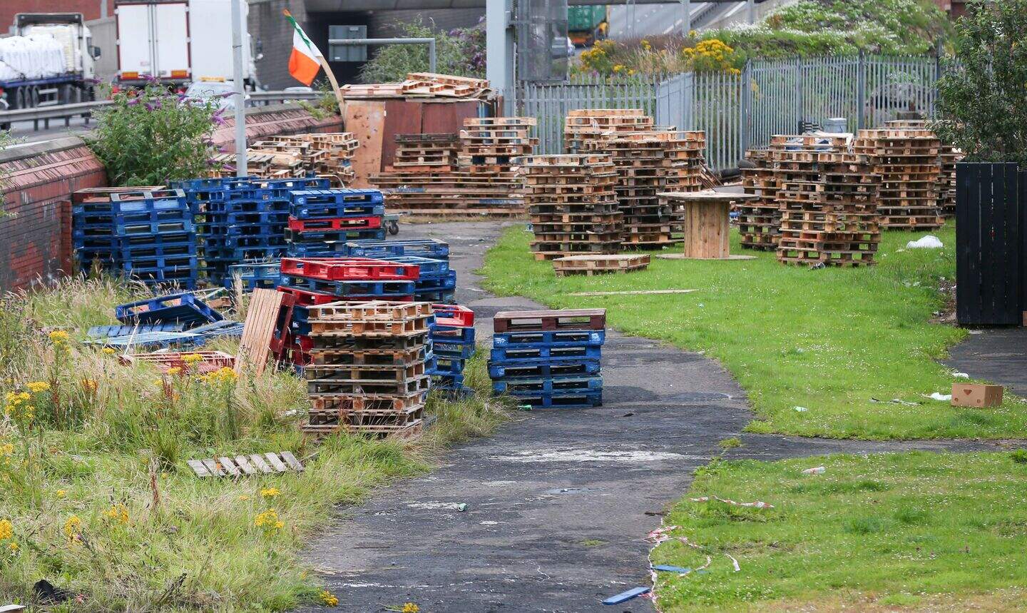 Police remove pallets gathered for republican bonfire in west Belfast ...