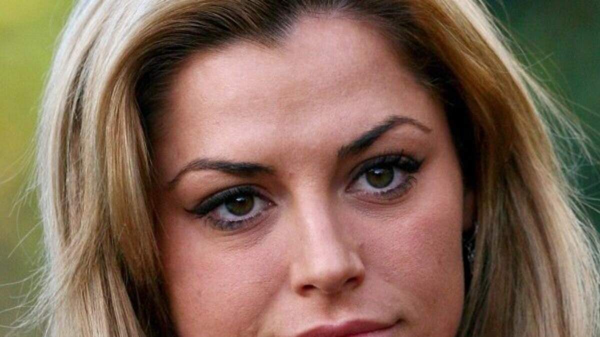 Guilty glamour model faints in dock | Belfast Telegraph
