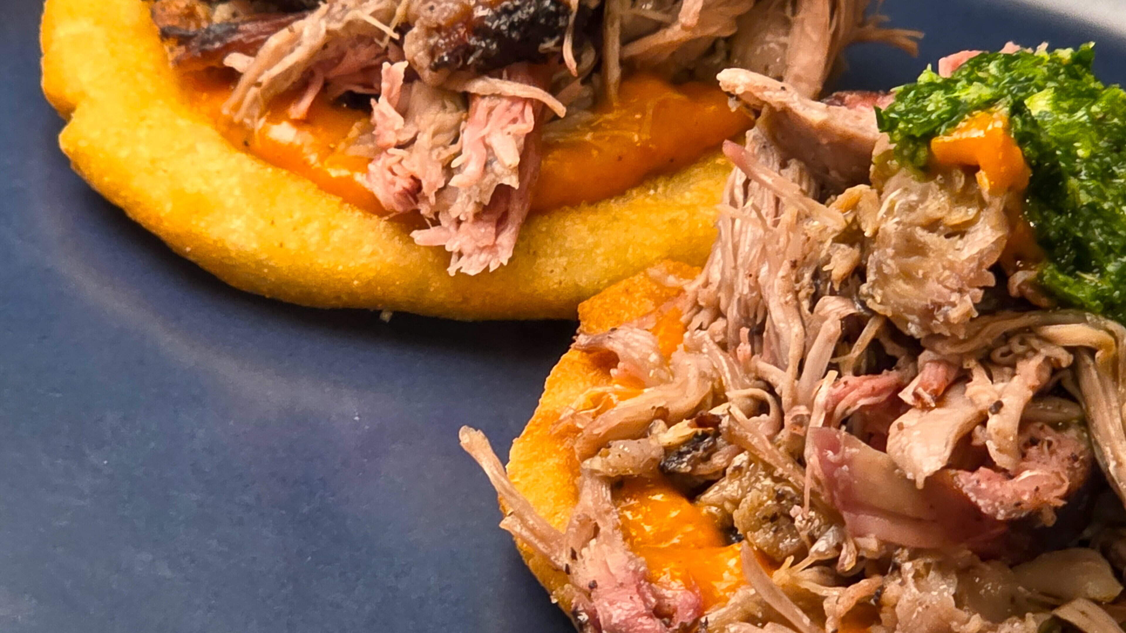 A recipe of smoke, spice and slow heat: Cocoa and coffee-rubbed lamb shoulder with tomato salsa and arepas