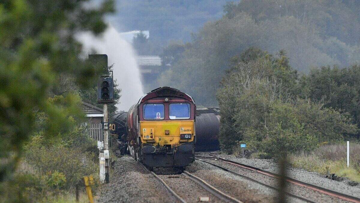 Fire on derailed diesel freight train ‘could burn for days’ | Belfast ...