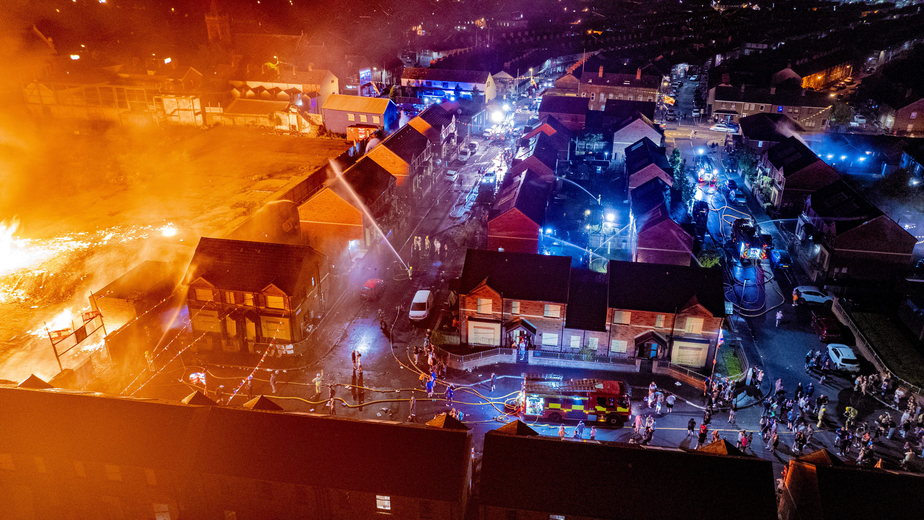 Fire crews deployed after Belfast bonfire collapses in direction of nearby homes