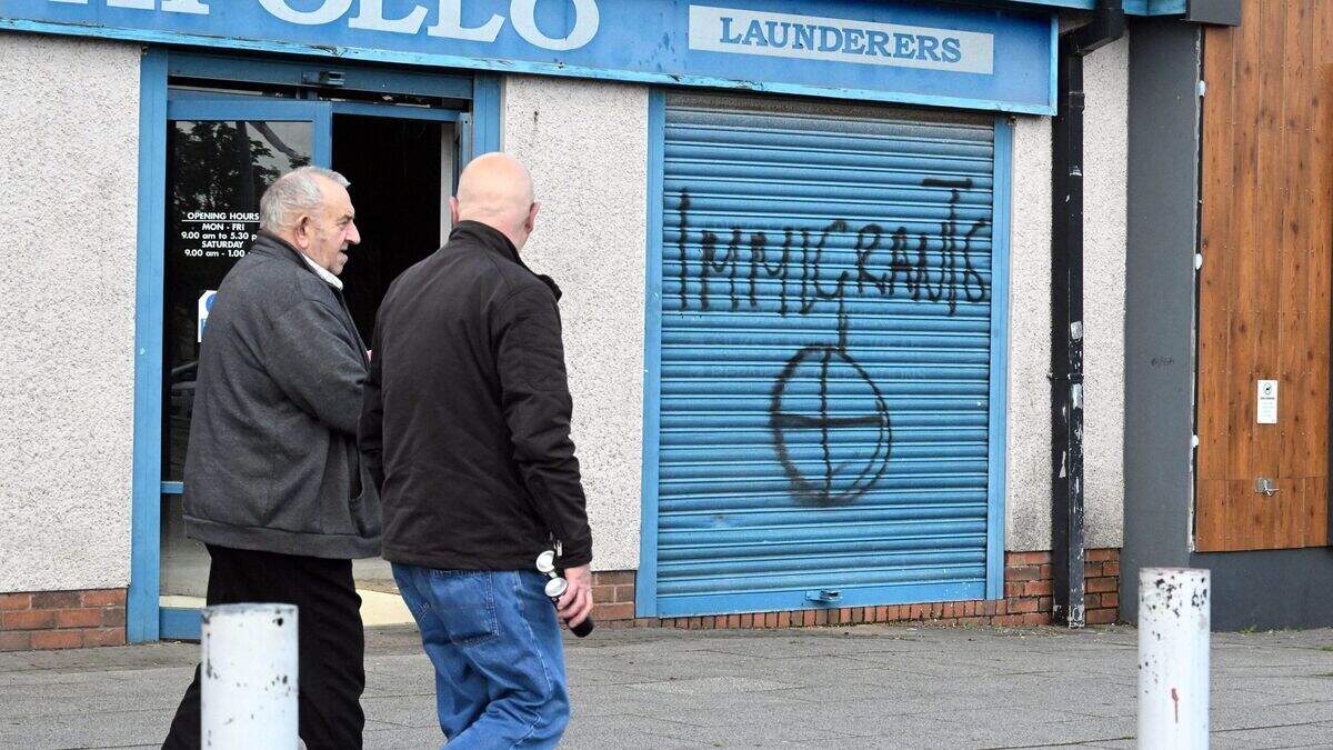 Hate crime probe launched after graffiti targeting migrants appears on ...