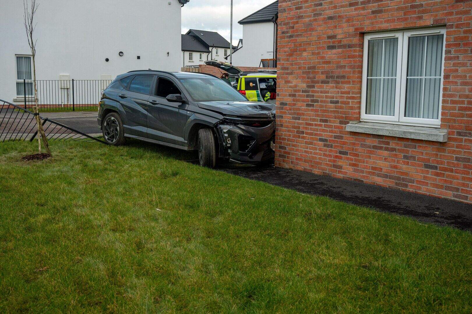 Emergency services respond after car collides with house in Derry ...