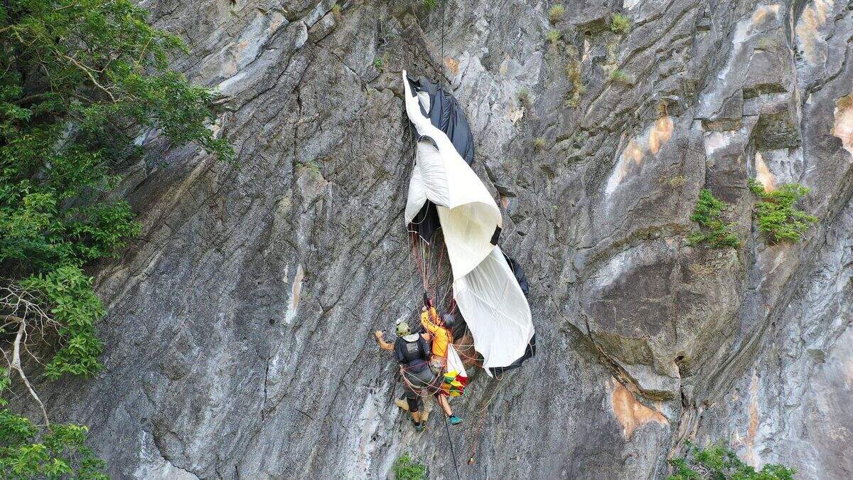 Base jumper rescued after dangling for hours from parachute caught on ...