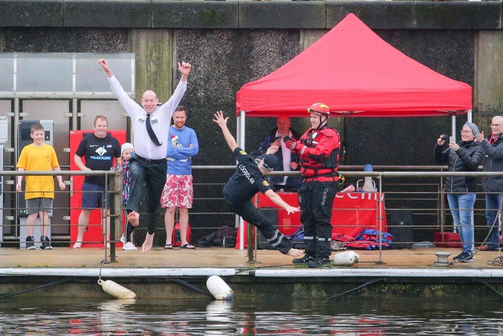 Splash! Charity fundraisers take polar plunge into Belfast's Lagan ...