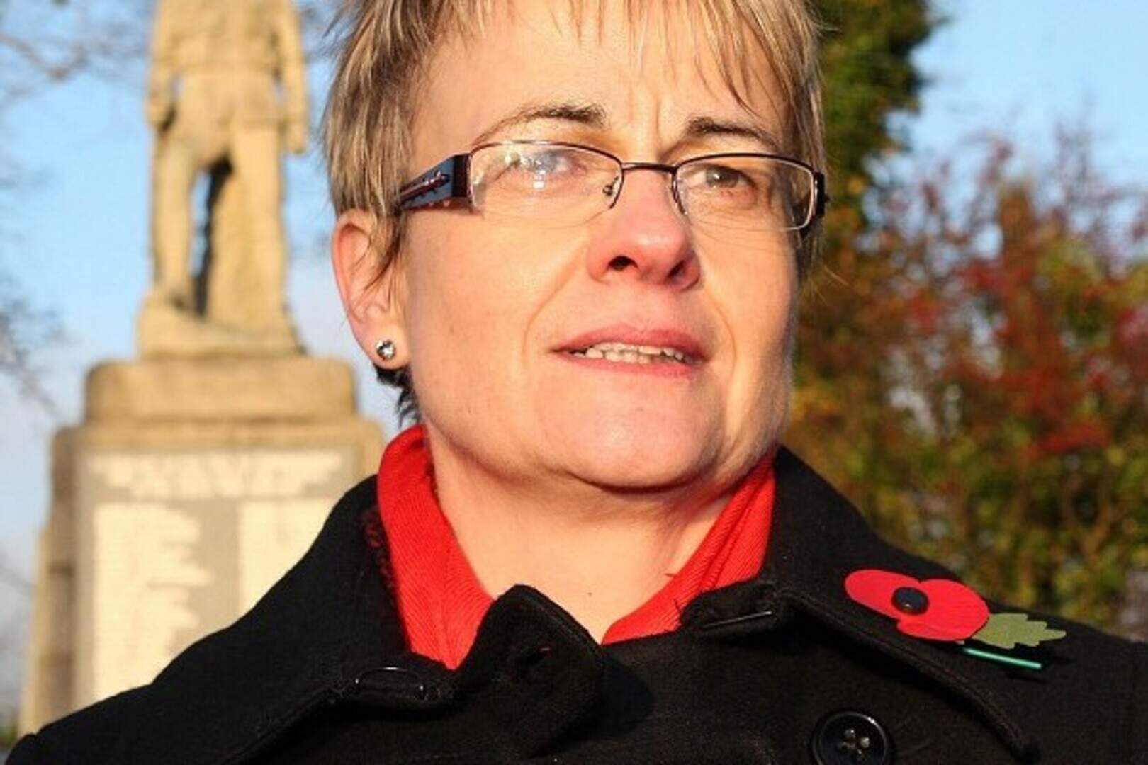 Attwood wears poppy on grave visit | Belfast Telegraph