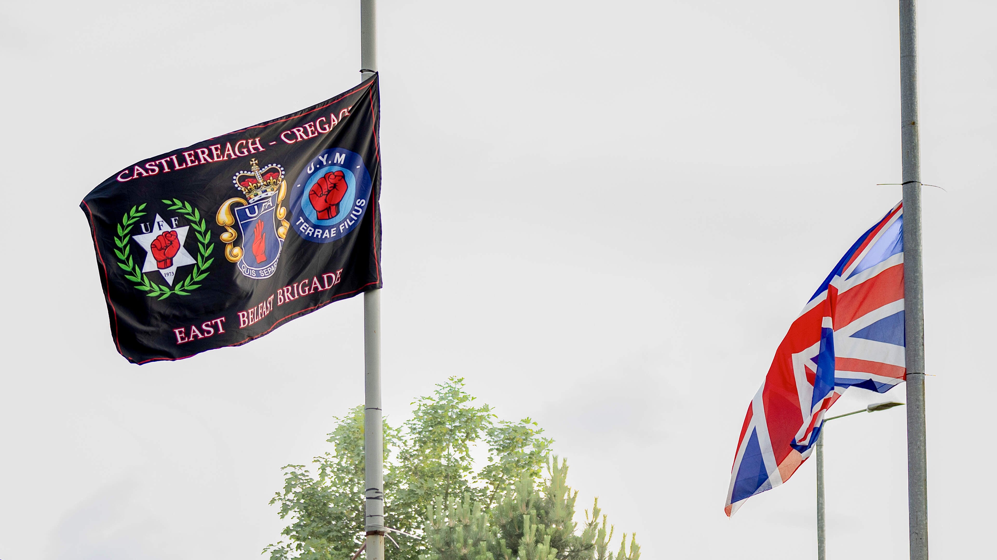 Police tear down UDA flags in east Belfast