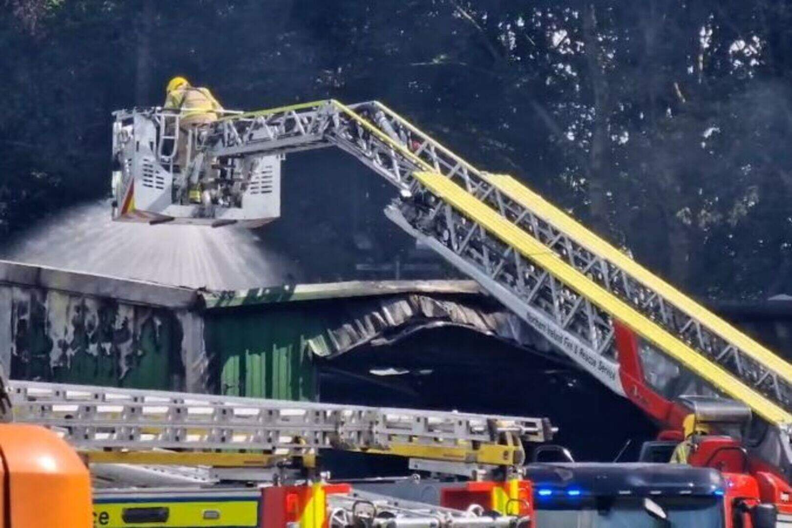 Firefighters at scene of ongoing fire at a recycling plant in Mallusk ...