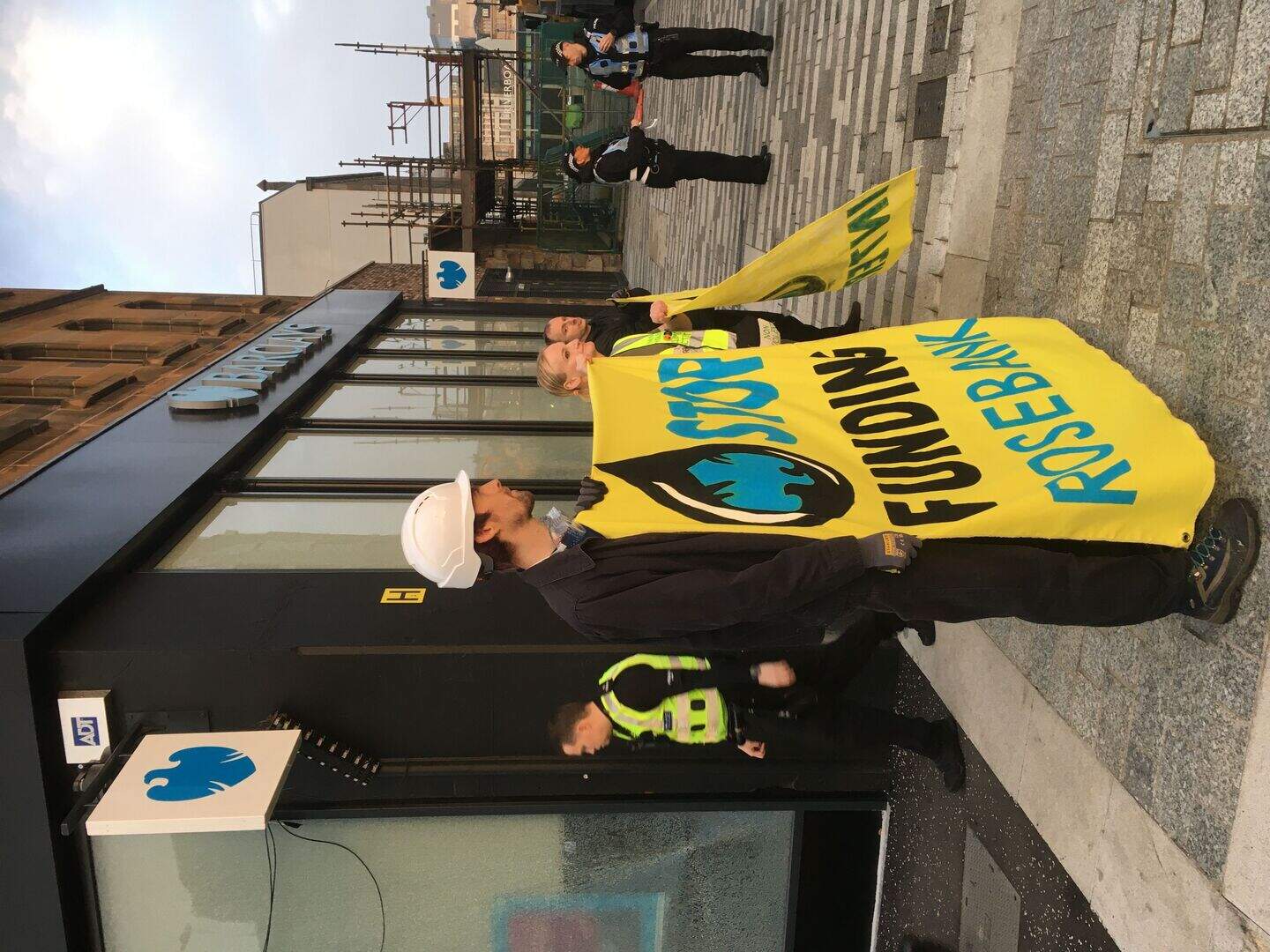 Two arrested after bank windows smashed in climate protest | Belfast ...