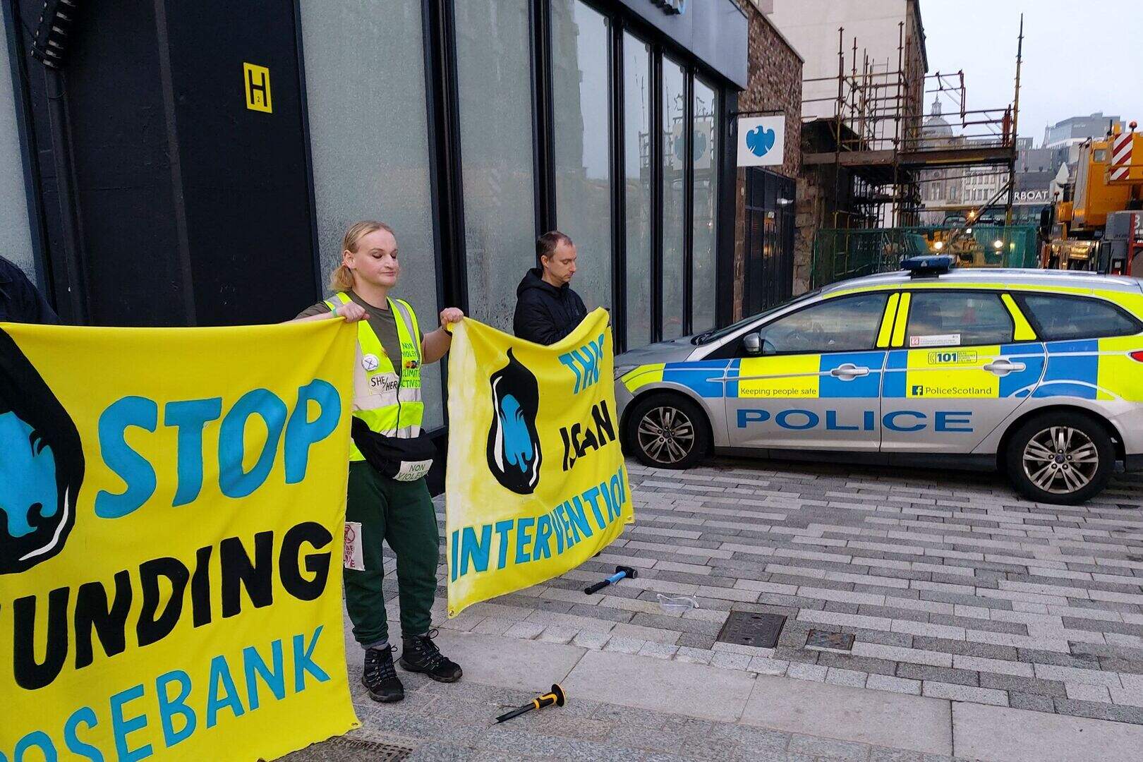 Two arrested after bank windows smashed in climate protest | Belfast ...