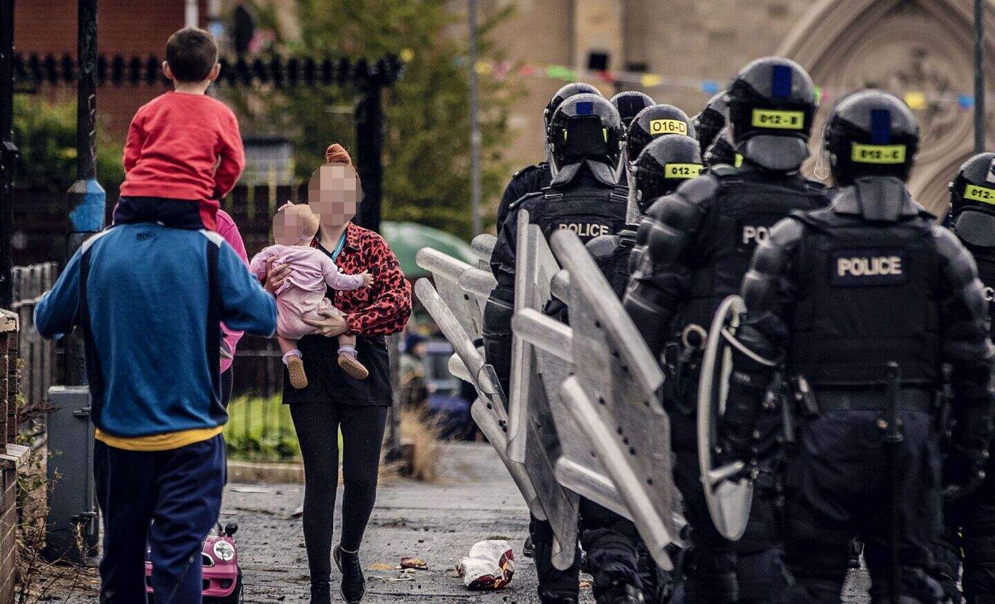Missiles thrown at PSNI during west Belfast bonfire removal | Belfast ...