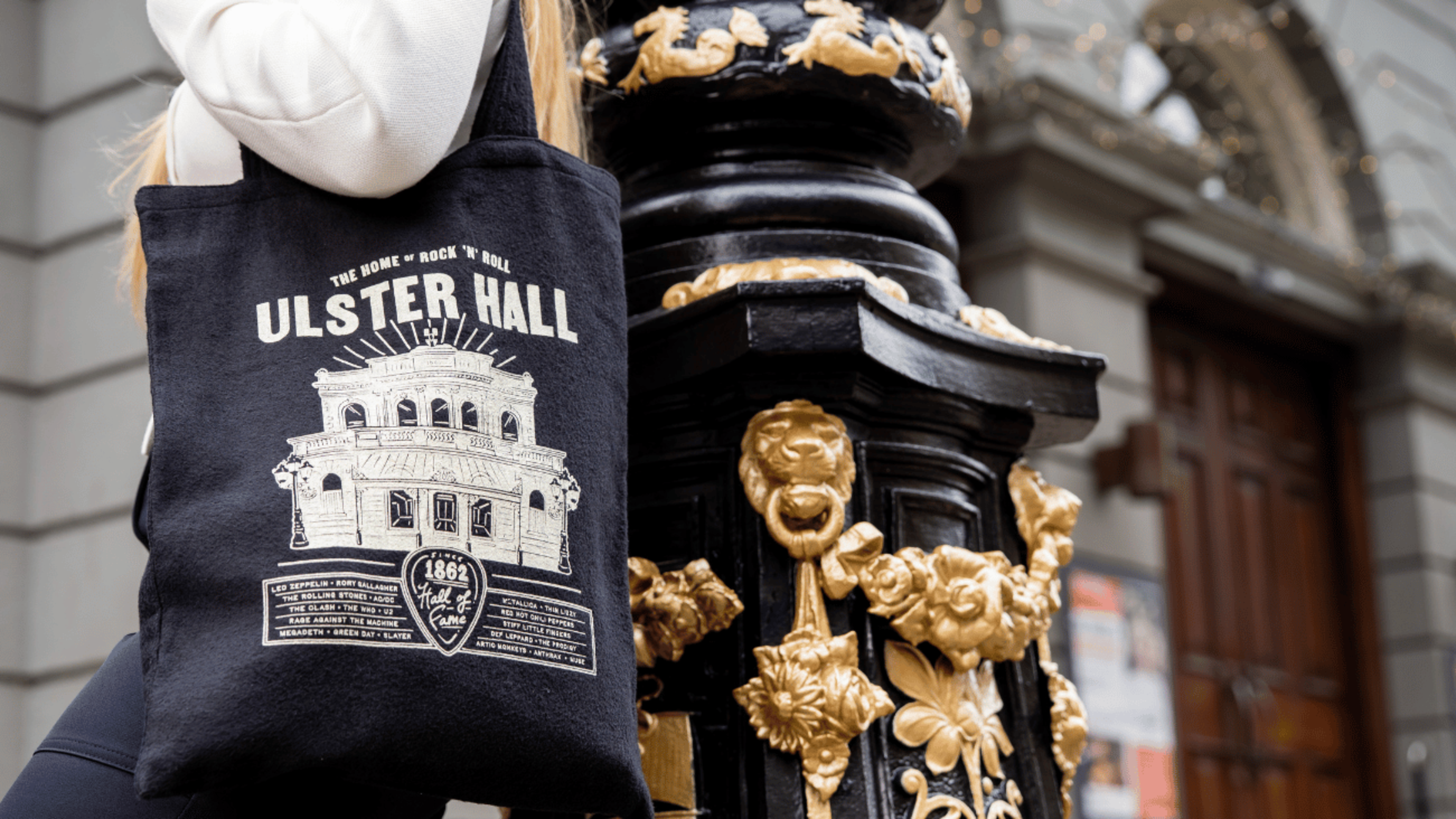 ‘They are cool little pieces of rock ‘n’ roll history’: Belfast designer turns retired Ulster Hall curtains into stylish bags