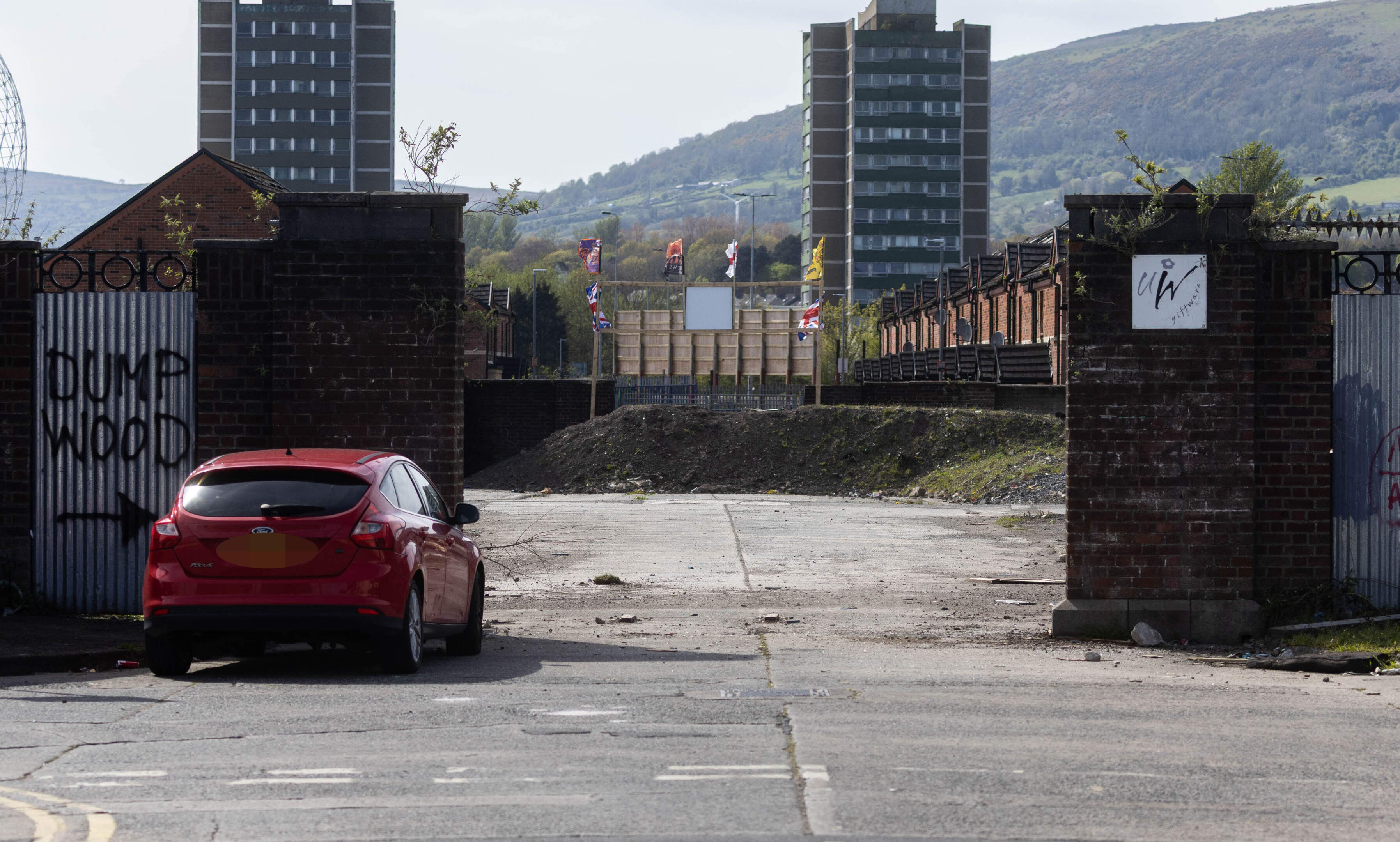 Pallets now piling up at Belfast ‘asbestos bonfire’ site after gate mysteriously removed