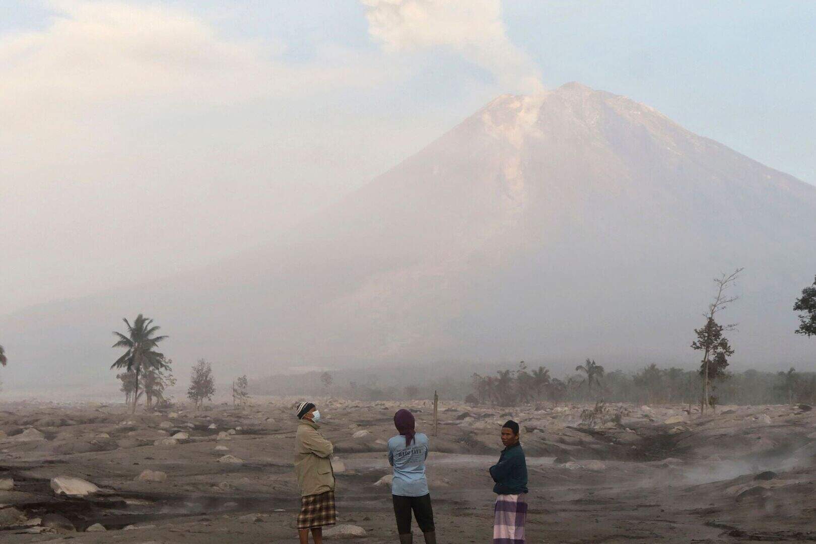 Search under way after volcanic eruption buries Indonesian island homes ...