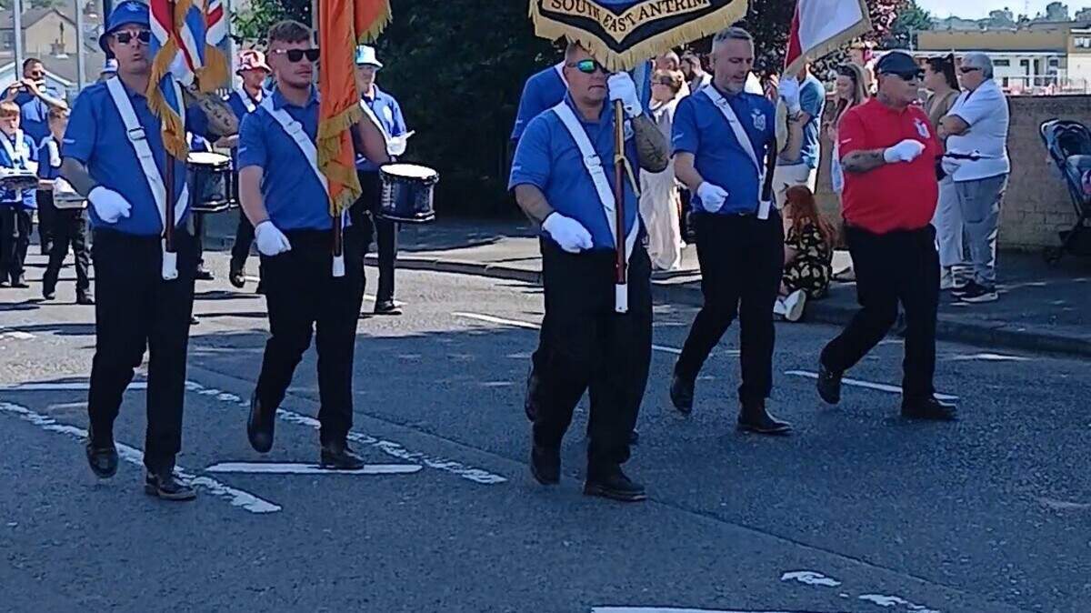 Thousands line streets of Ballymena as hot weather takes its toll on Lambeg drummers