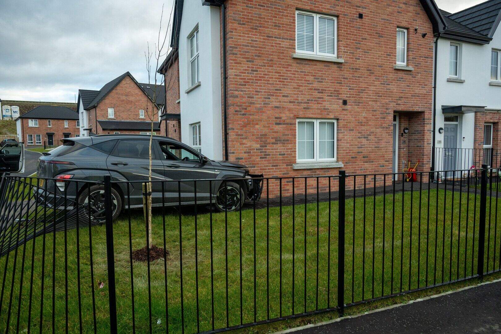 Emergency services respond after car collides with house in Derry ...
