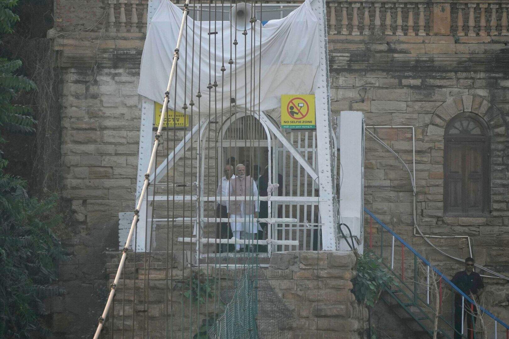 Indian PM visits site of bridge collapse which killed 135 | Belfast ...