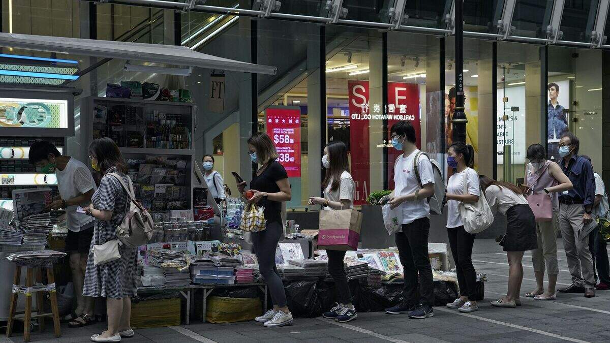 Hong Kong residents defend free press after raid on newspaper critical ...