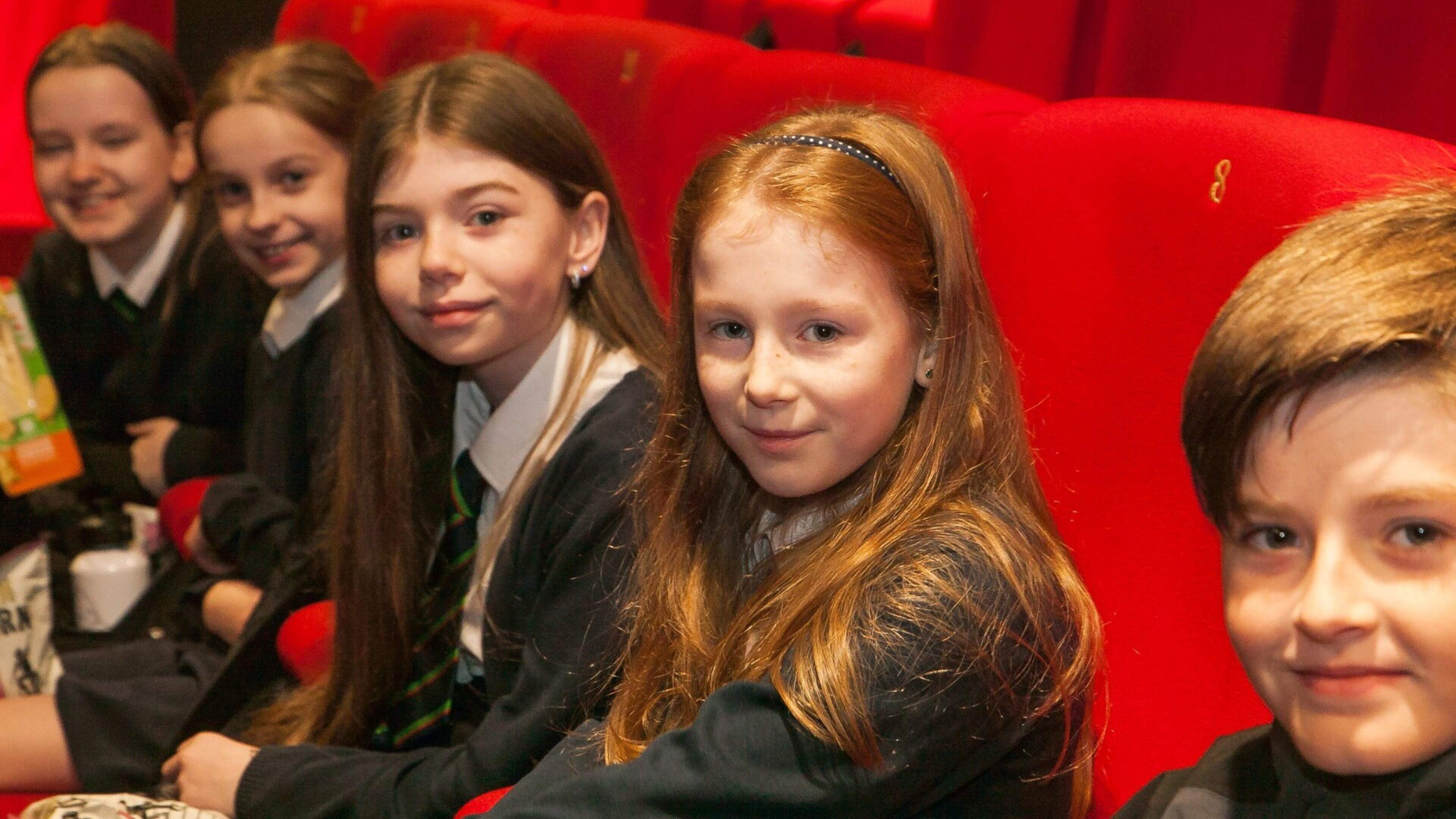Children across Northern Ireland will be treated to free cinema screenings in November as part of the Into Film Festival. Pictured here are children enjoying a previous screening at QFT as part of the festival