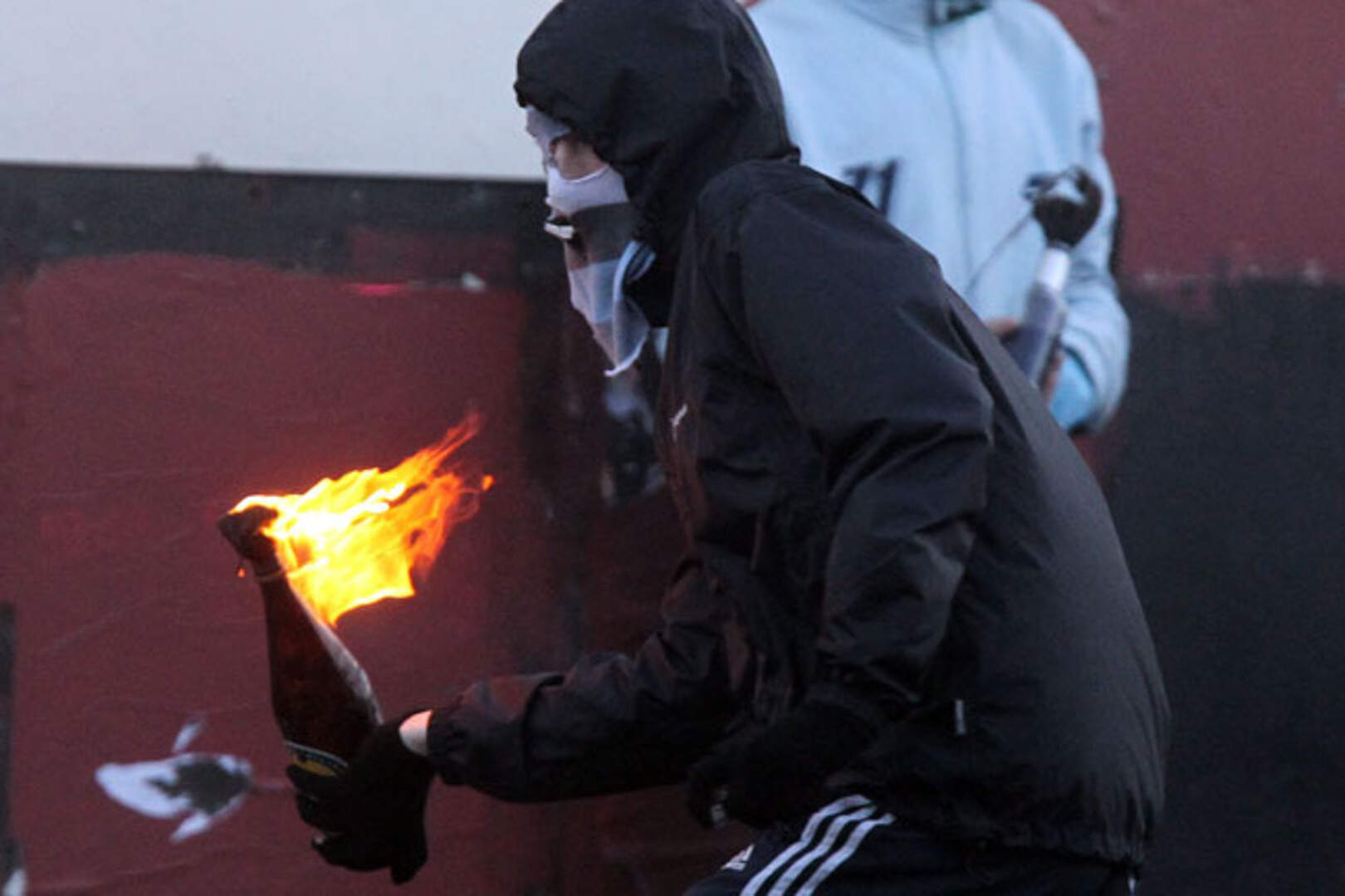 Police officers torched and targeted with lasers in Belfast riot ...