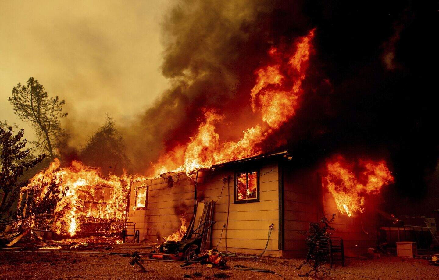 Wildfire forces evacuations in California as woman held on suspicion of ...
