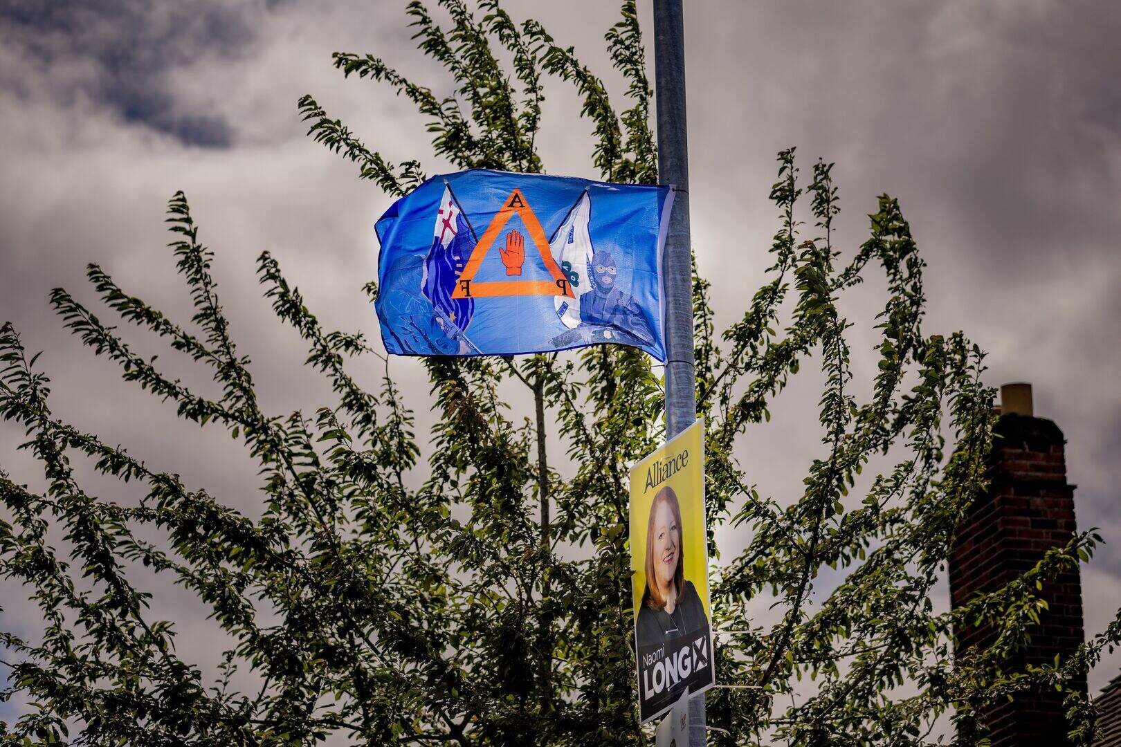Paramilitary flags erected outside east Belfast polling station hours ...