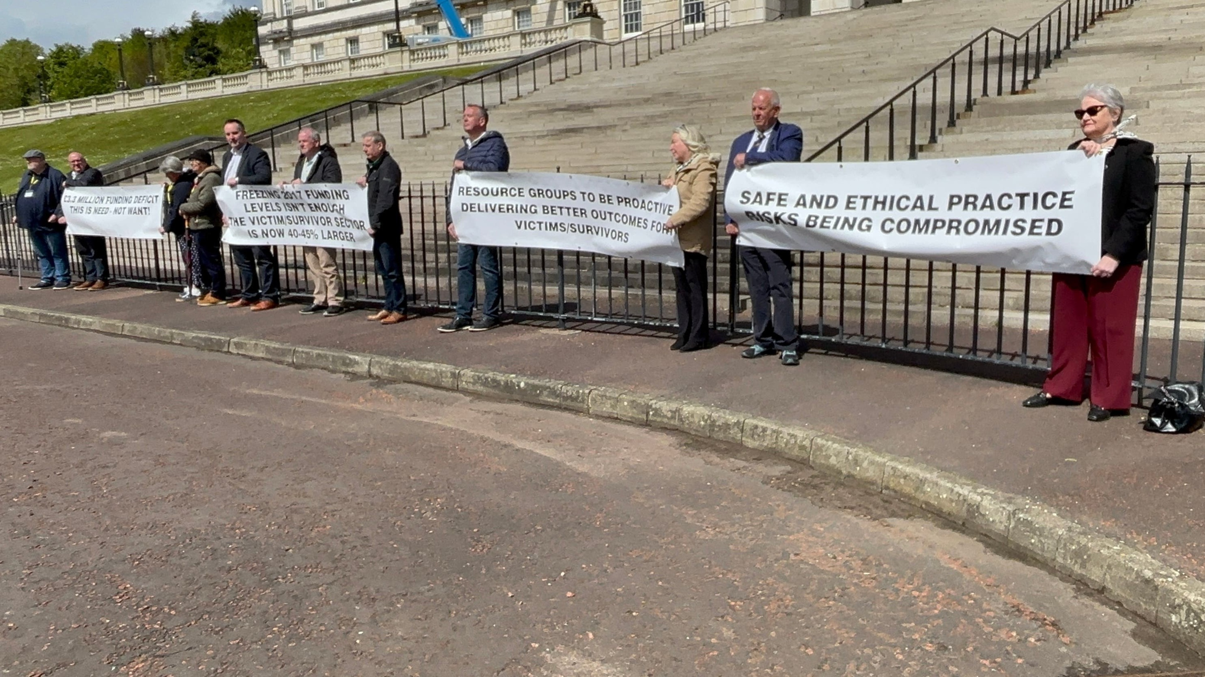 Victims groups demonstrate at Stormont over funding crisis in the sector