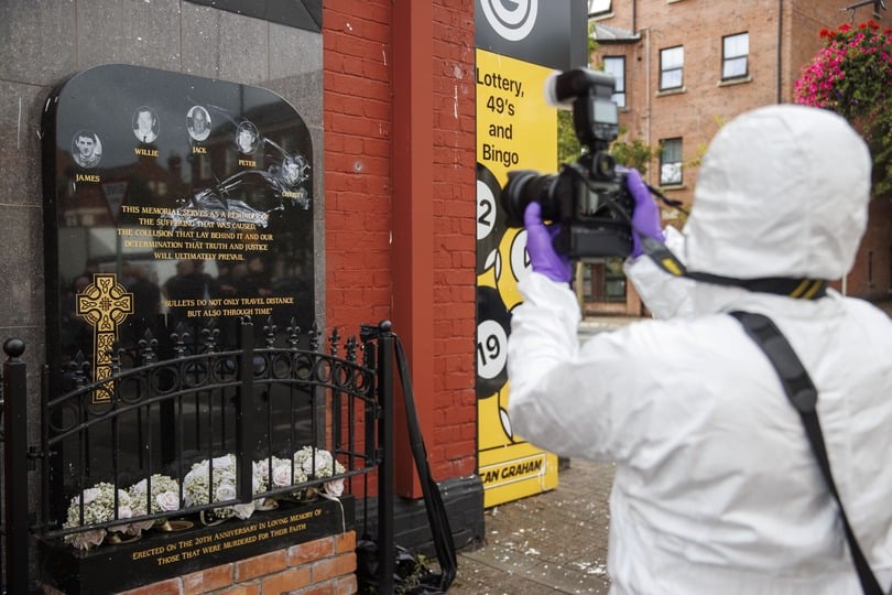 The damaged memorial plaque for the victims of a UDA gun attack in Belfast (Liam McBurney/PA)