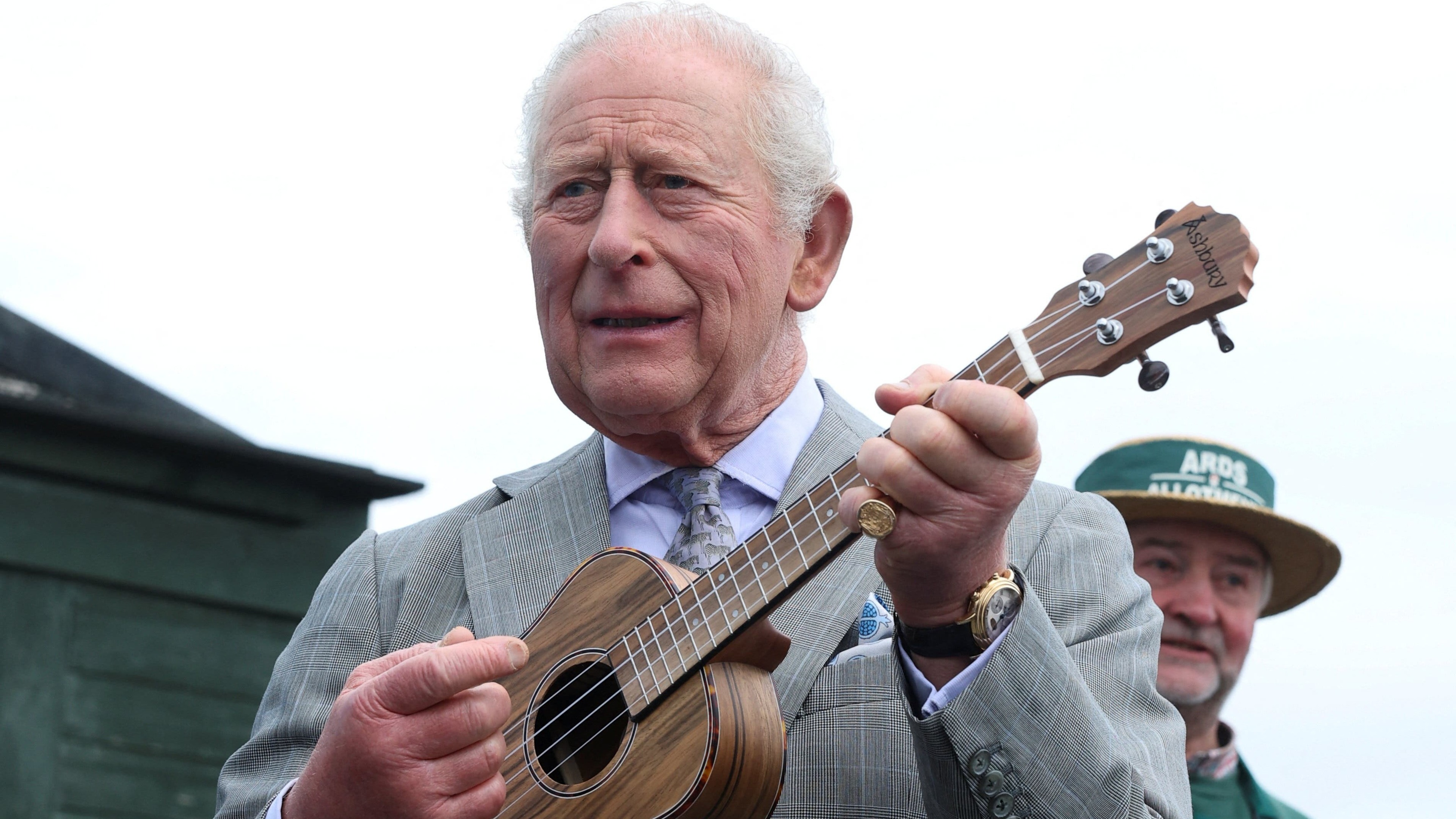 Charles and Camilla tour Northern Ireland, with Charles playing ukulele