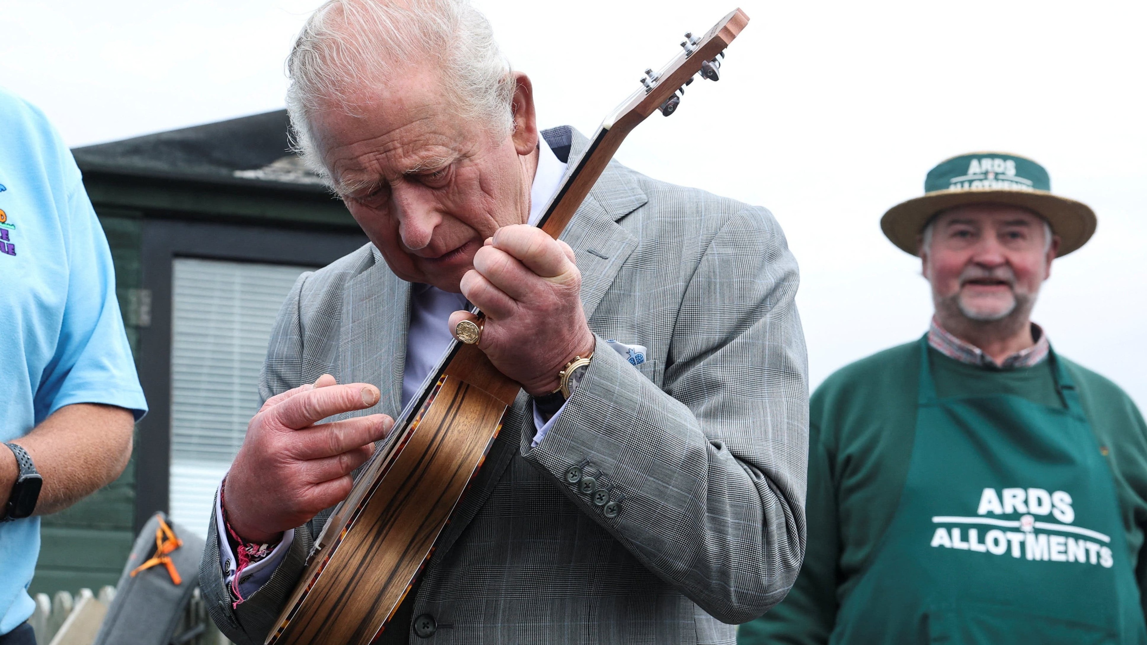 Charles shows plenty of pluck as he picks up ukulele on Northern Ireland visit