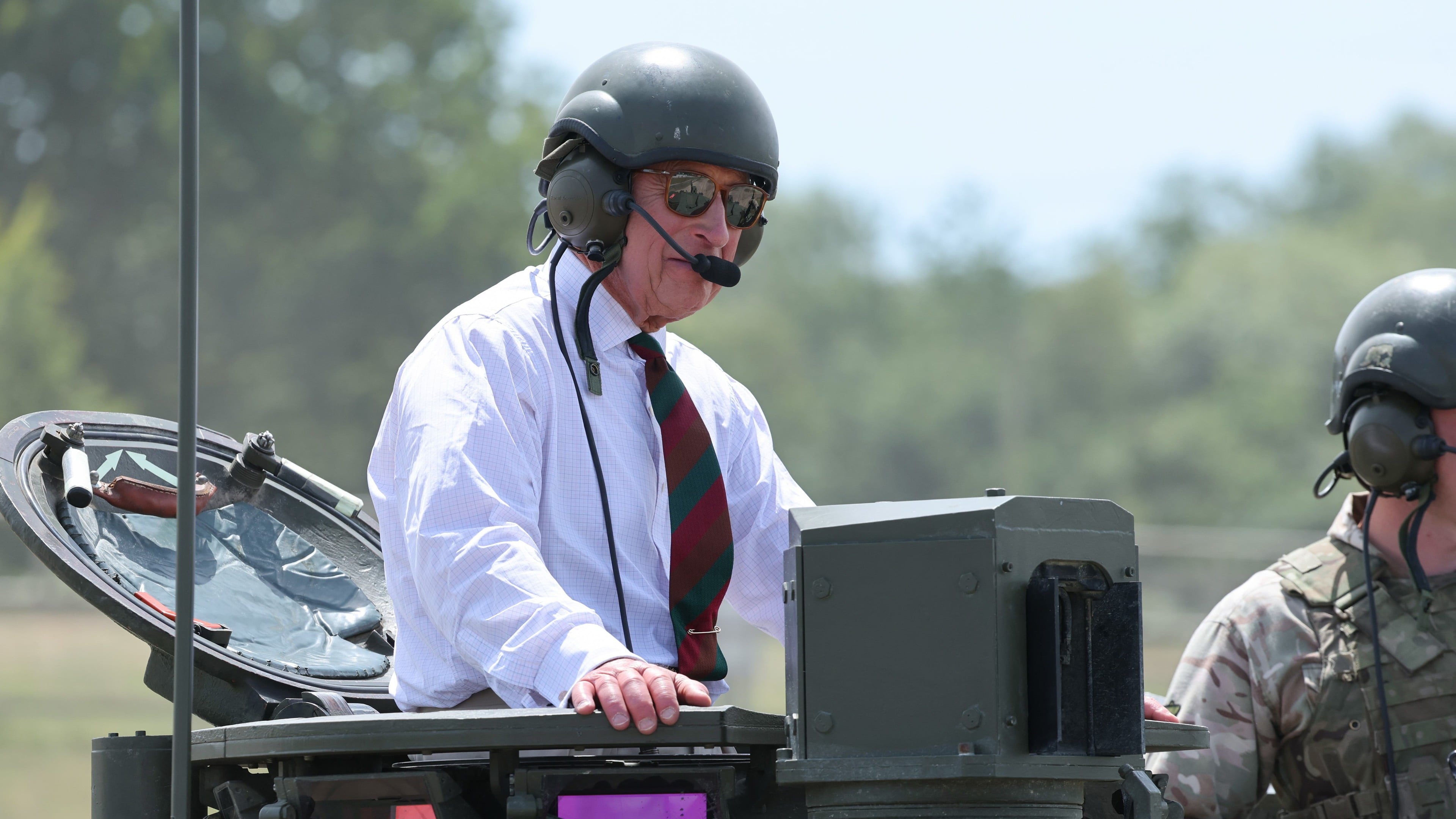 King Charles rides British Army tank during regimental visit