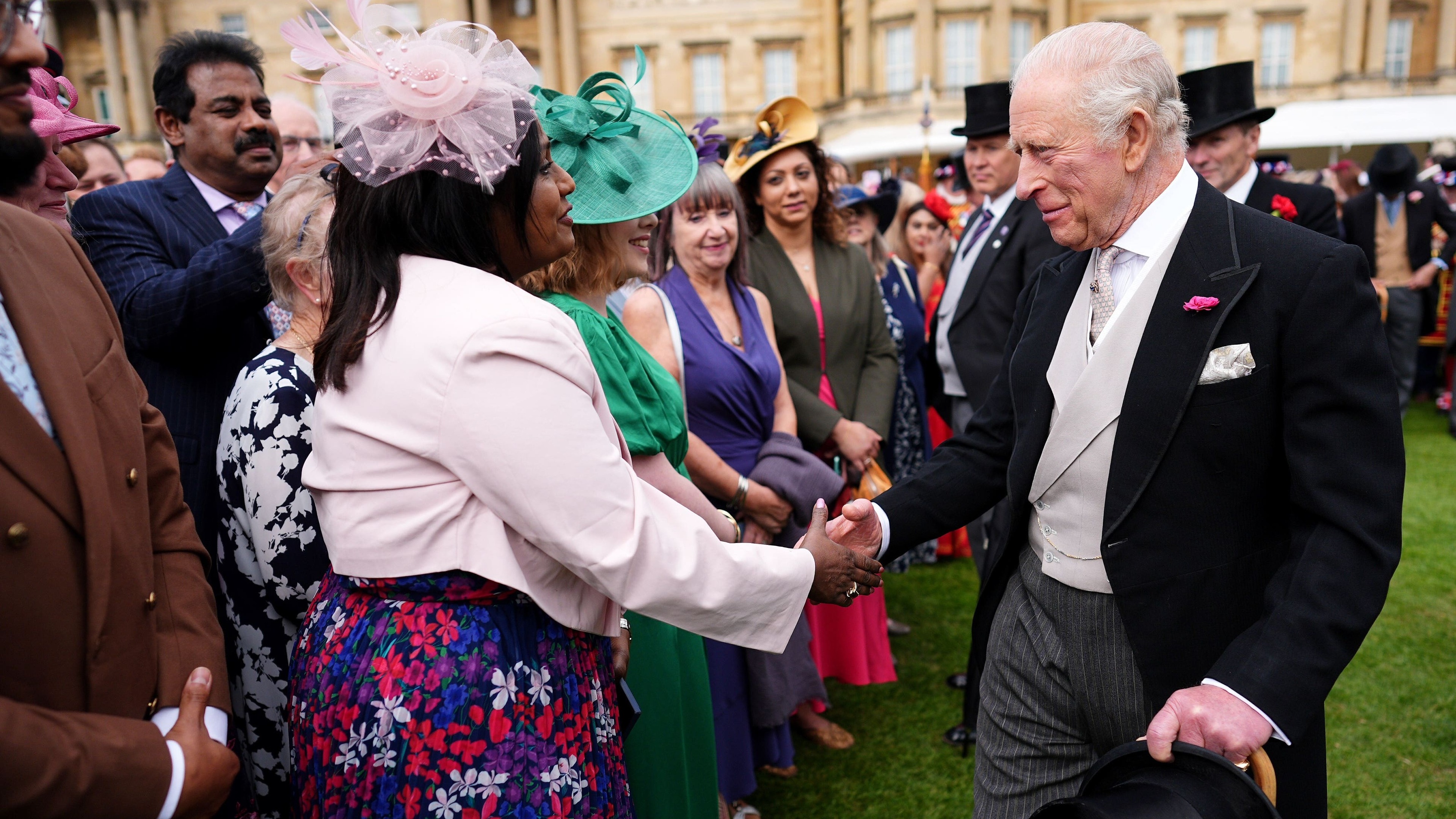 King jokes about getting older at palace garden party
