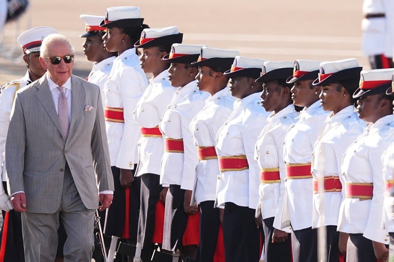 Charles inspects the guard of honour, made up of members of the Royal Bahamas Police Force and the Royal Bahamas Defence Force, as he arrives at Lynden Pindling International Airport, in Nassau, at the start of the royal visit to The Bahamas (Aaron Chown/PA)