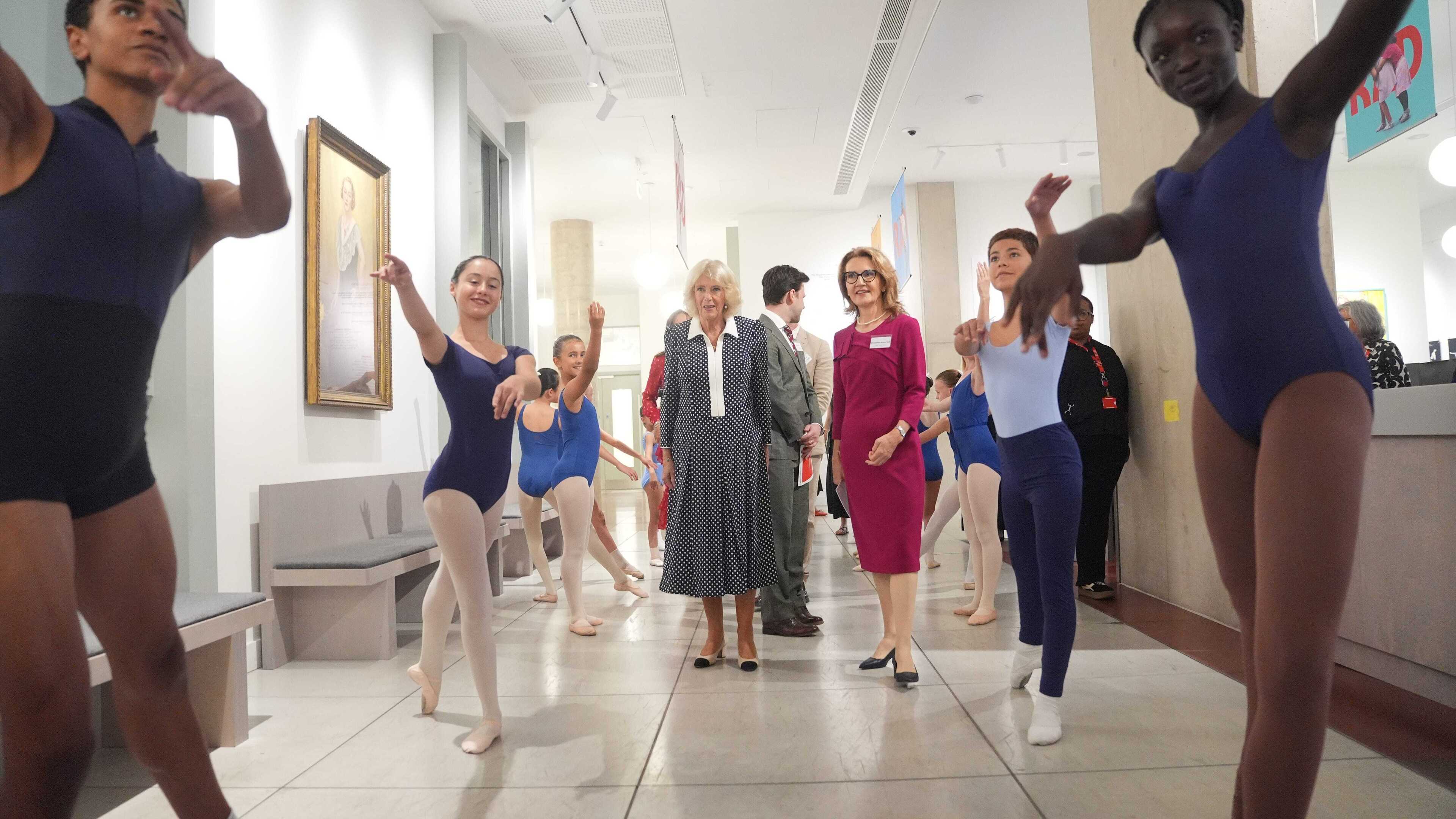 Queen visits Royal Academy of Dance, welcomed as Silver Swans participant