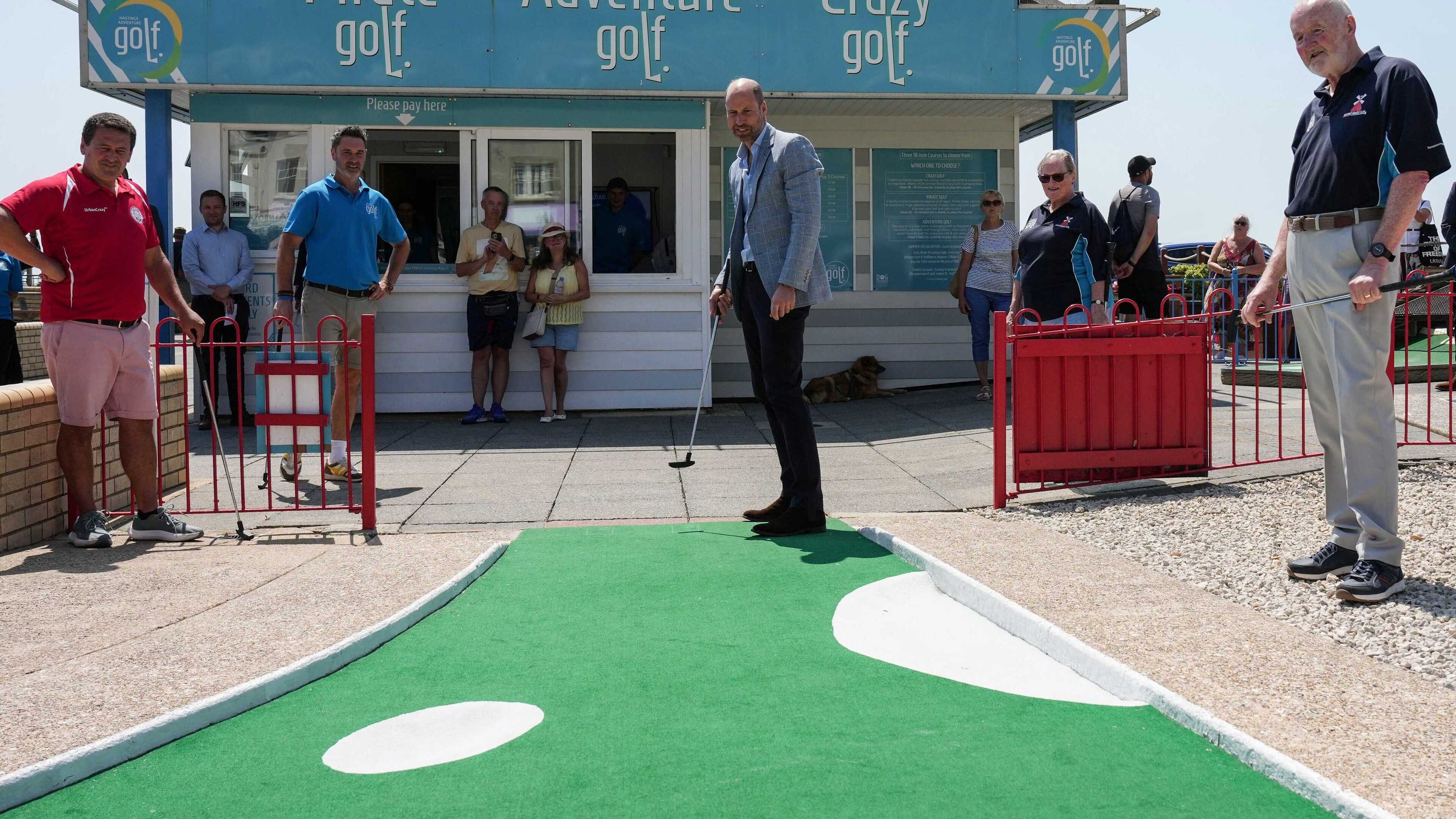 Prince of Wales plays crazy golf after ride on funicular