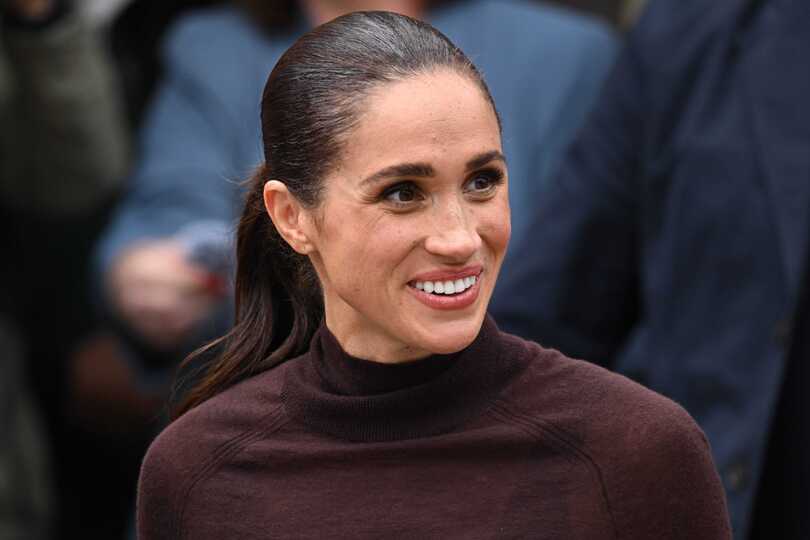 The Duchess of Sussex could seen lighting a candle, filling a champagne glass and placing chocolate bars on plates at a dining table (PA)